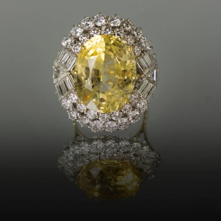 Platinum ring with 20.40 carat unheated yellow sapphire and E-F color VVS-VS clarity round brilliant, baguette and trillion cut diamonds weighing approximately 4.50 carats
