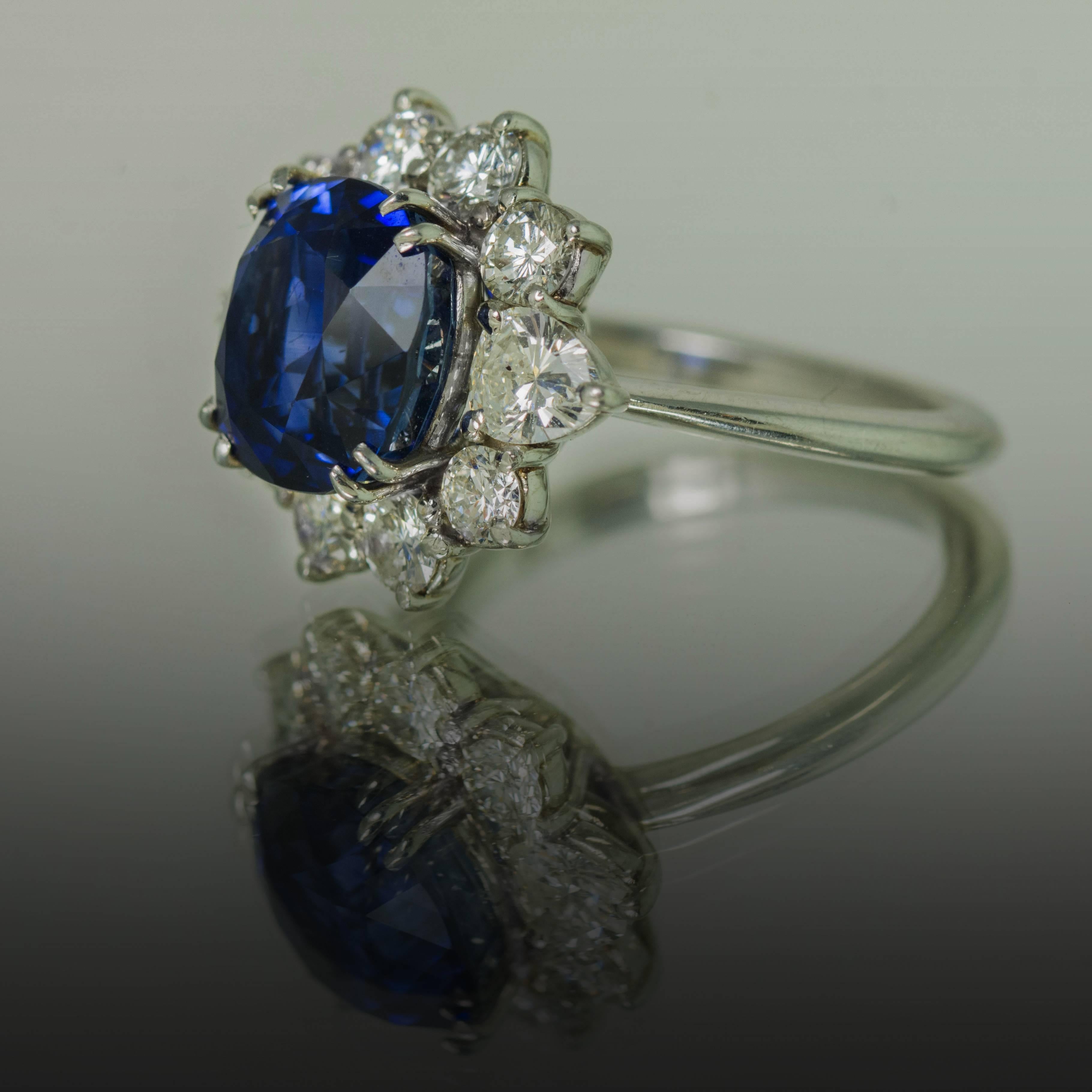 Platinum Ring with Royal Blue Sapphire weighing 5.78 carats and accompanied by an American Gem Labs certificate. In addition there are 8 round brilliant and 2 pear shape diamonds weighing 1.31 carats. 