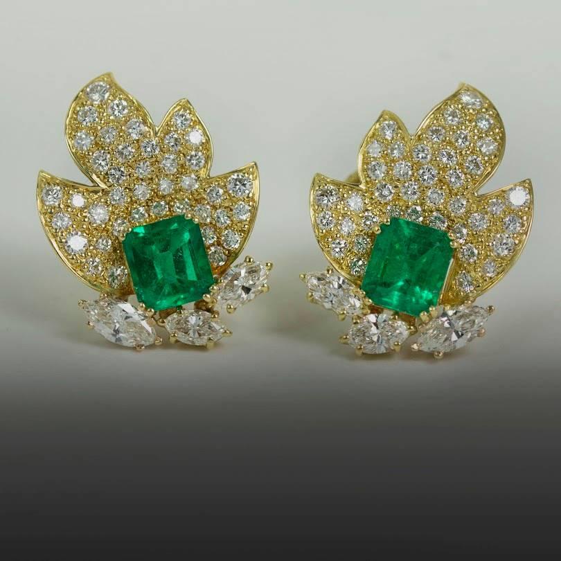 Hand Fabricated 18k Yellow Gold Earrings by Keith Davis for Thayer Jewelers. Containing two beautiful emerald cut Colombian emeralds  weighing 3.22 carats and 6 marquis cut diamonds weighing 2.56 carats and 80 pave set round brilliant diamonds