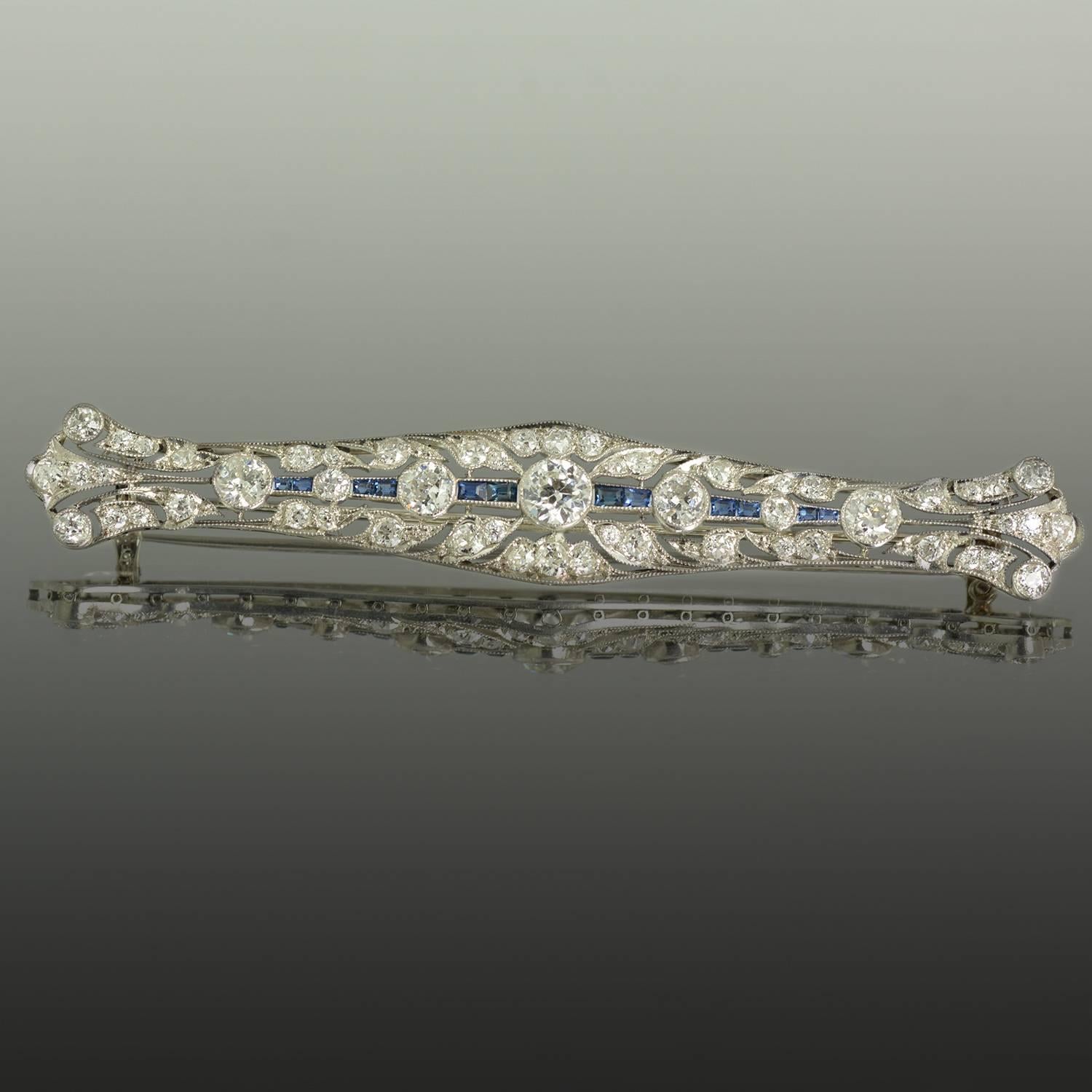 Platinum Edwardian Brooch with approximately 5.00 carats of fine quality Old European cut diamonds and approximately 0.75 carats of square cut natural sapphires, 3" long, 