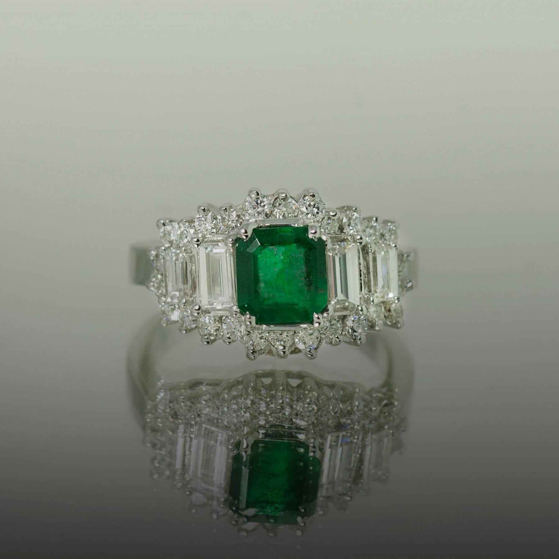 14k White gold ring with 1 square emerald cut emerald weighing 1.28 carats and round brilliant and straight baguette diamonds weighing 1.55 carats, Size 6 1/2