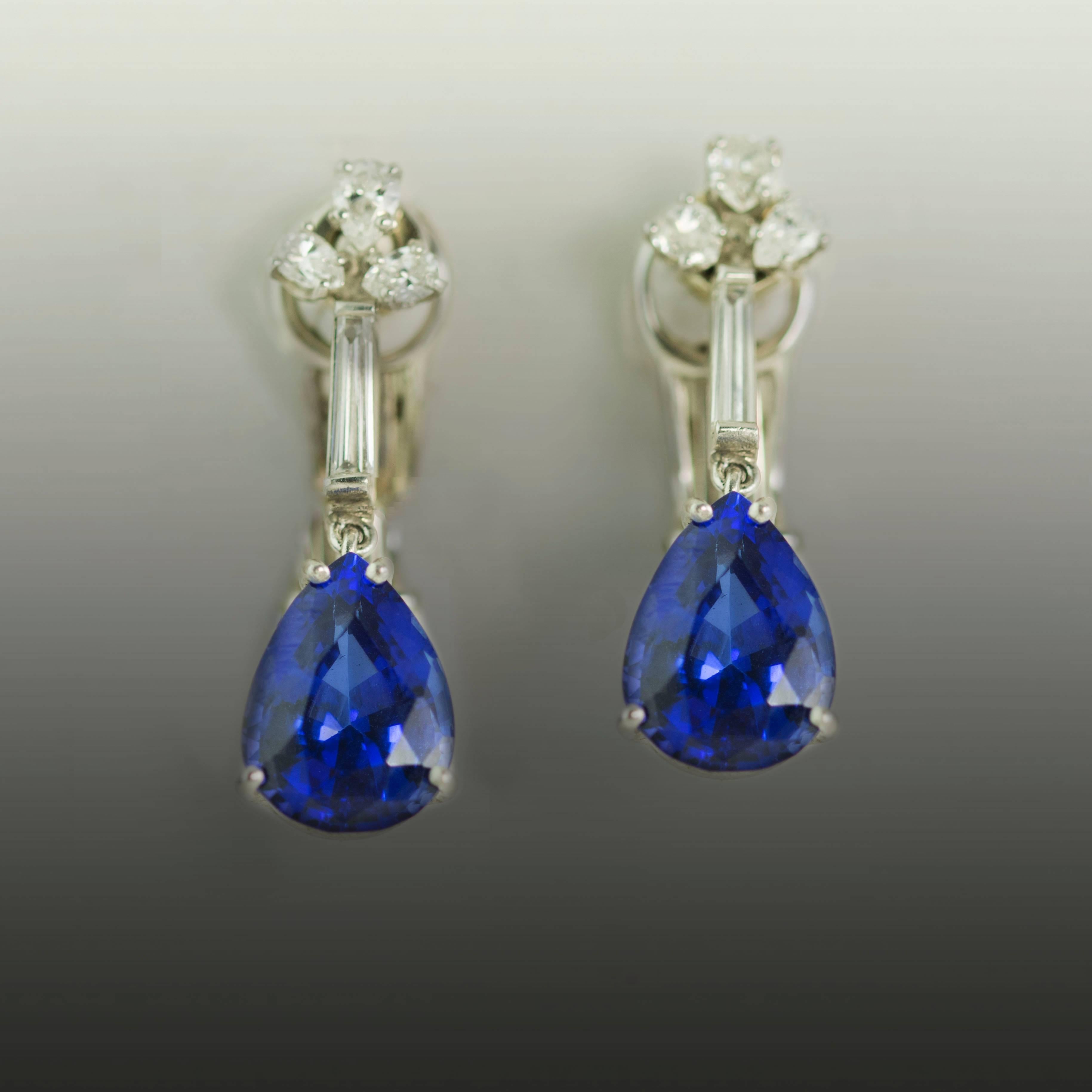 Platinum Earrings with 2 pear shape Tanzanites weighing 9.59 carats and 6 pear shape and two tapered baguette diamond weighing 1.01 carats.