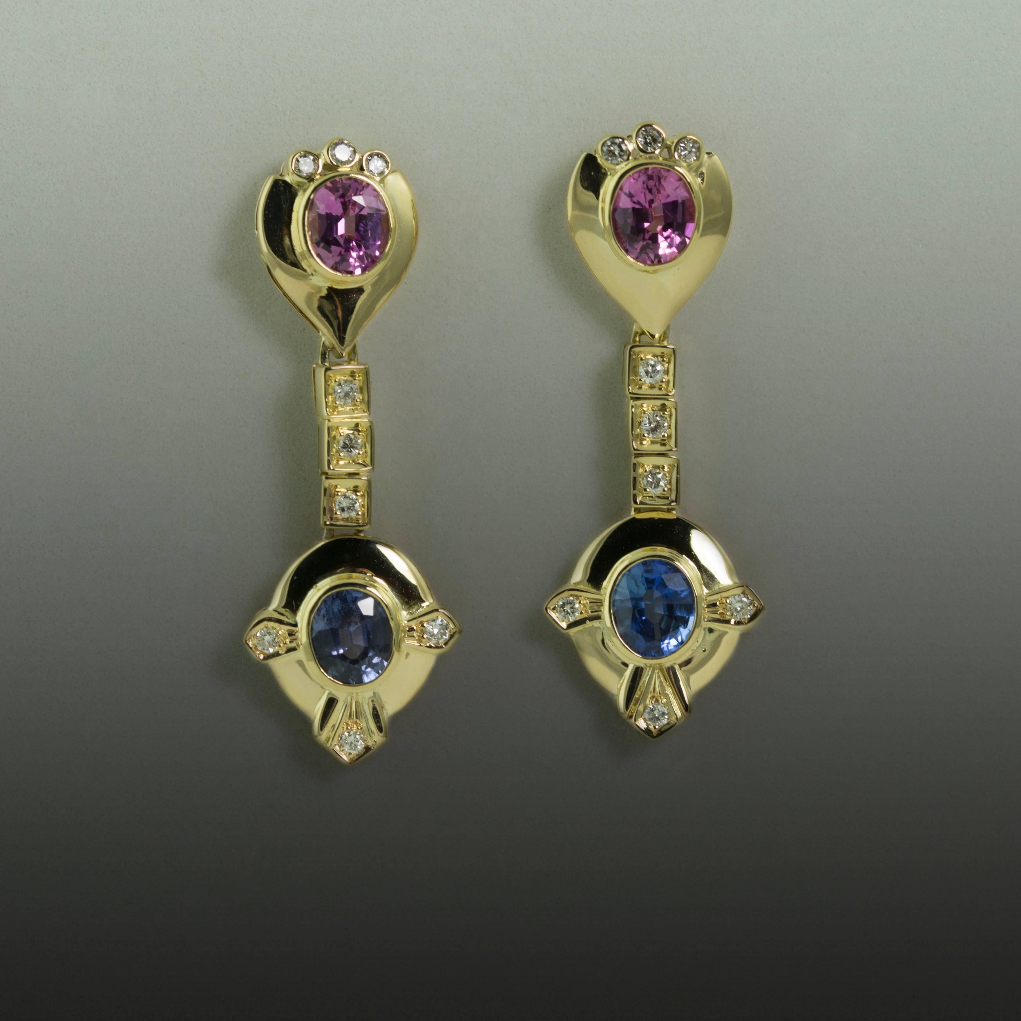 18k Earrings with 2 Pink Sapphires and 2 Blue Sapphires weighing 2.93 carats and 18 round brilliant diamonds weighing 0.27 carats. 