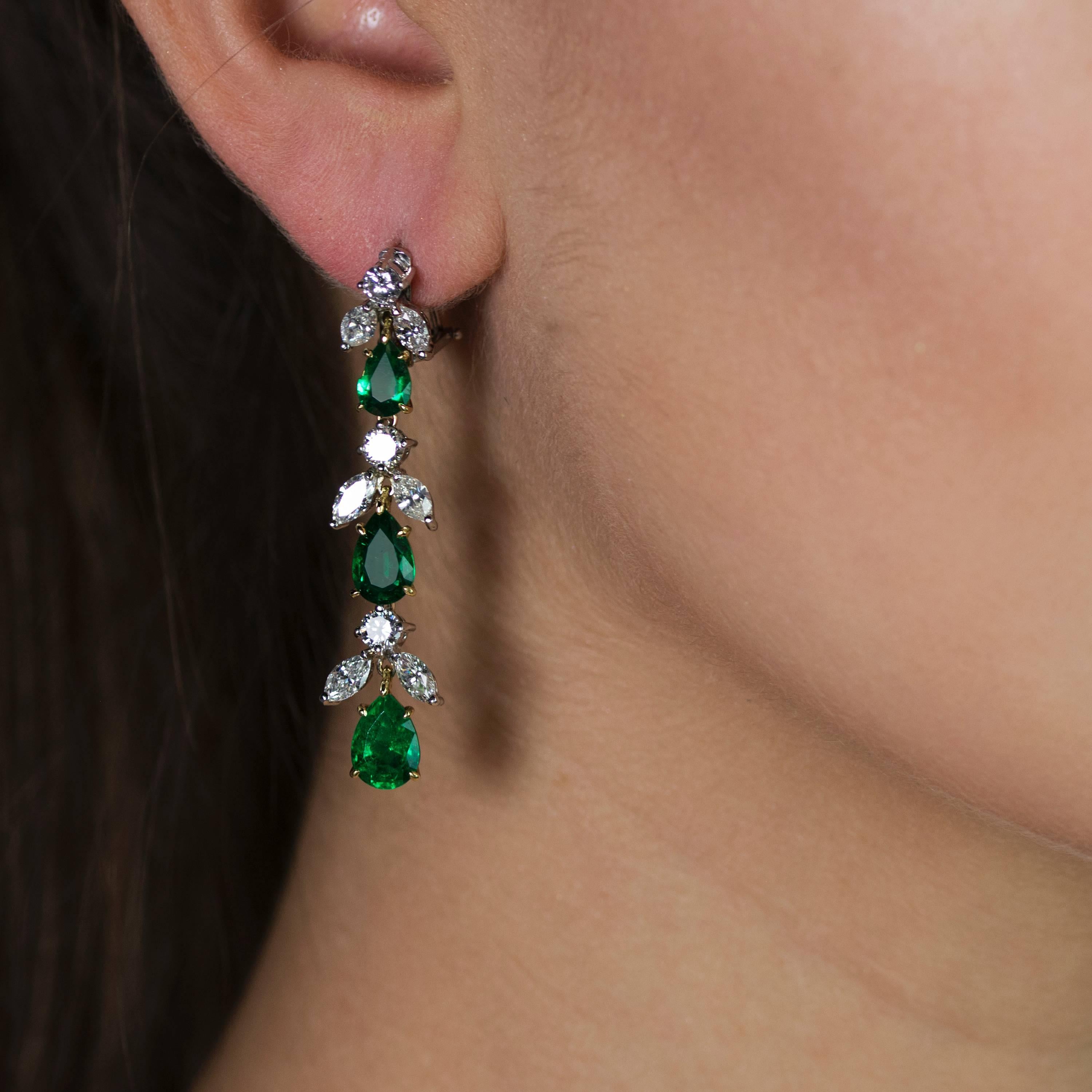 Platinum Earrings with 6 pear shape Emeralds weighing  6.11 carats and 12 marquis cut and 6 round brilliant cut diamonds weighing 5.42 carats.
