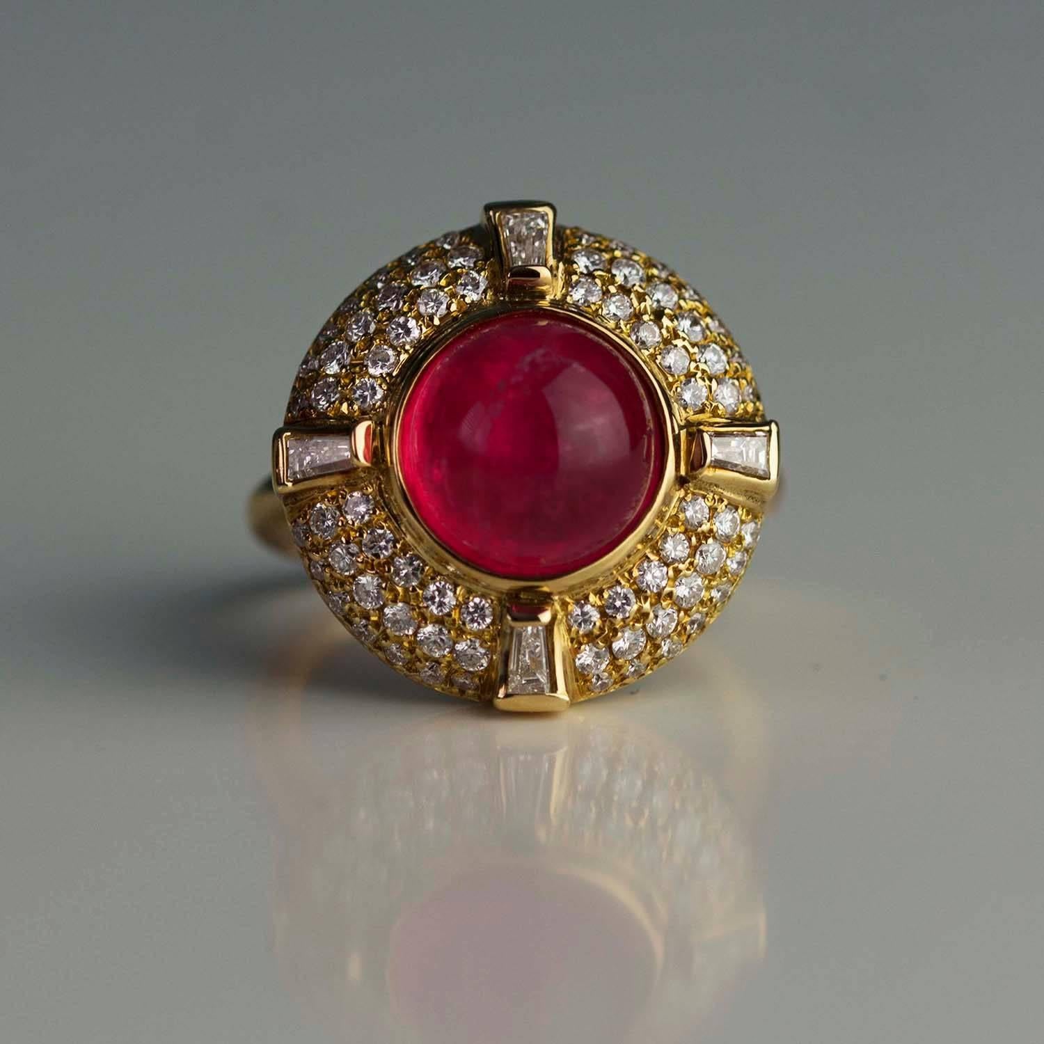 Gorgeous 18k ring with a cabochon pink tourmaline weighing approximately 5.00 carats and collection color/clarity diamonds weighing approximately 1.25 carats.  Complimentary expert ring sizing included.