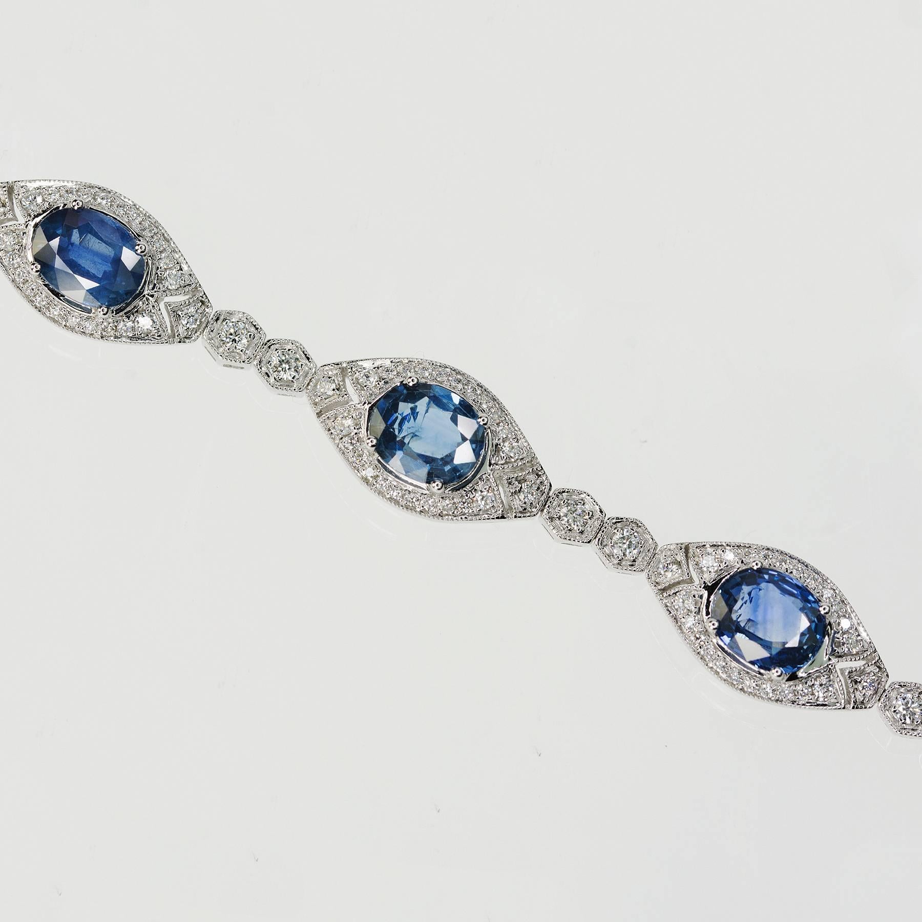 18k White Gold Bracelet with 7 oval sapphires weighing 11.13 carats and round brilliant diamonds weighing 1.51 carats. 7