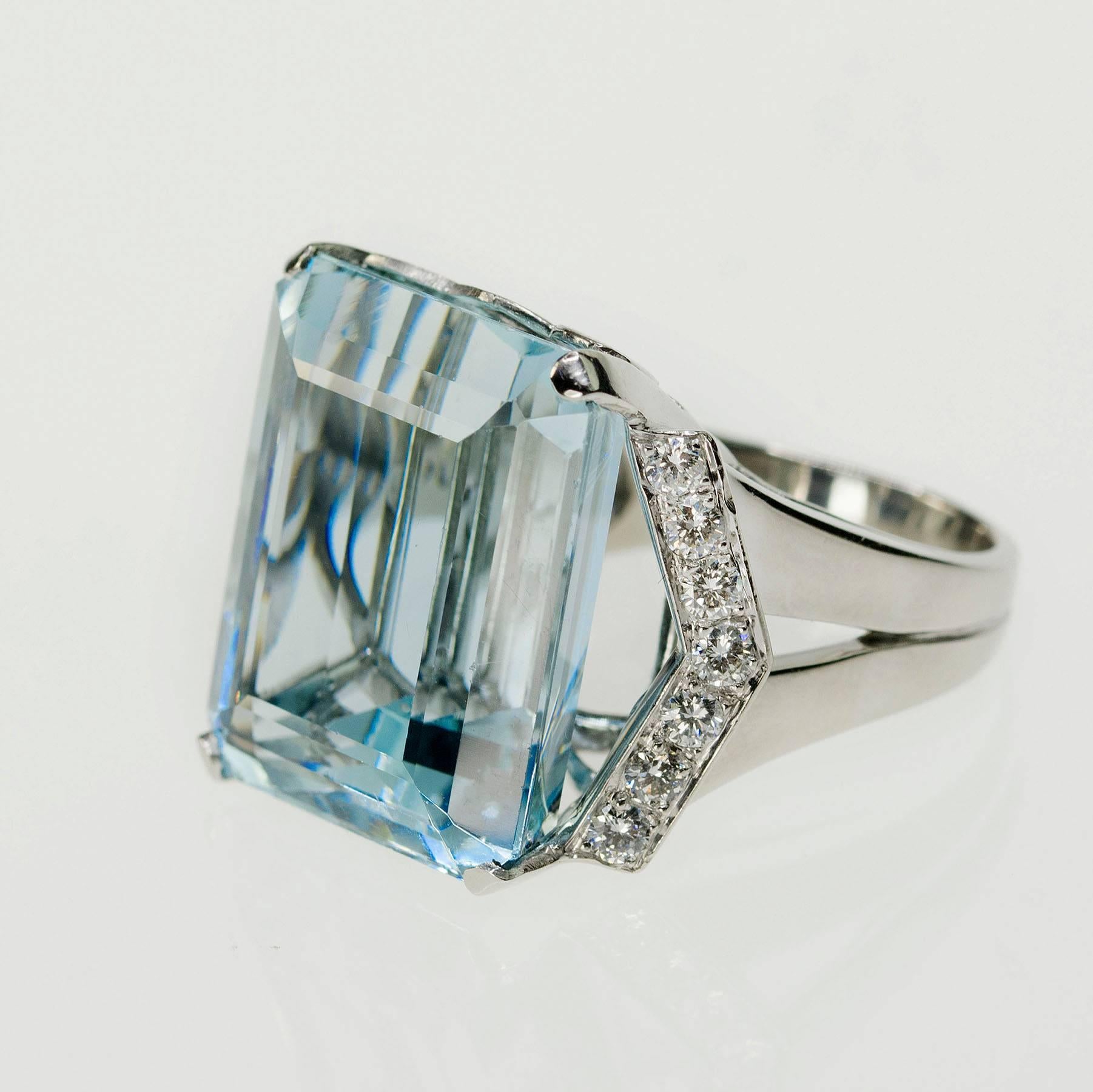 Beautiful hand fabricated platinum Ring with 35,24 Carat Aquamarine and 14 round brilliant diamonds weighing approximately 1.20 carats.