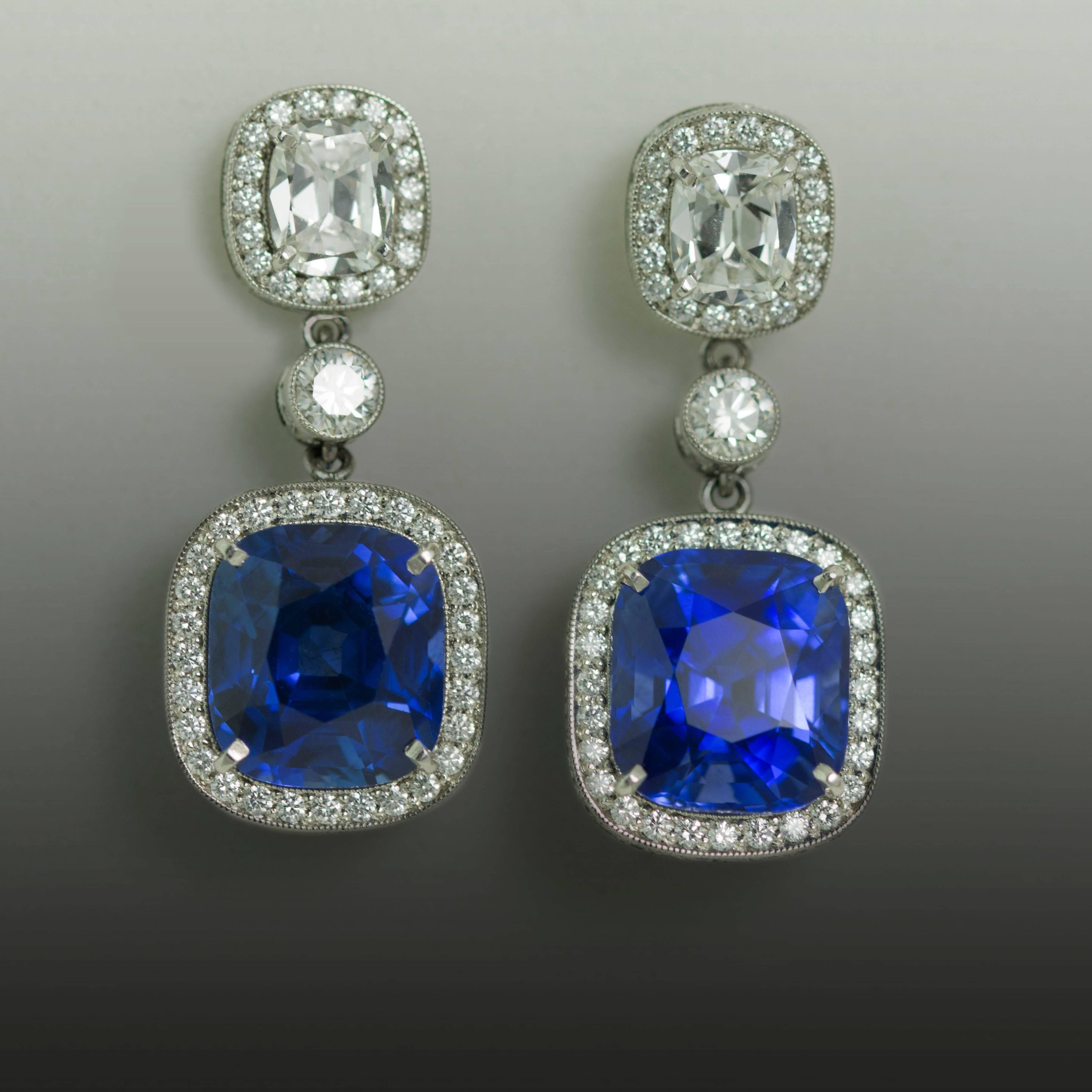 Stunning Platinum Earrings with 2 top gem quality natural cushion cut sapphires weighing 9.74 carats and two cushion cut diamonds weighing 1.30 carats and round diamonds weighing 1.68 carats.