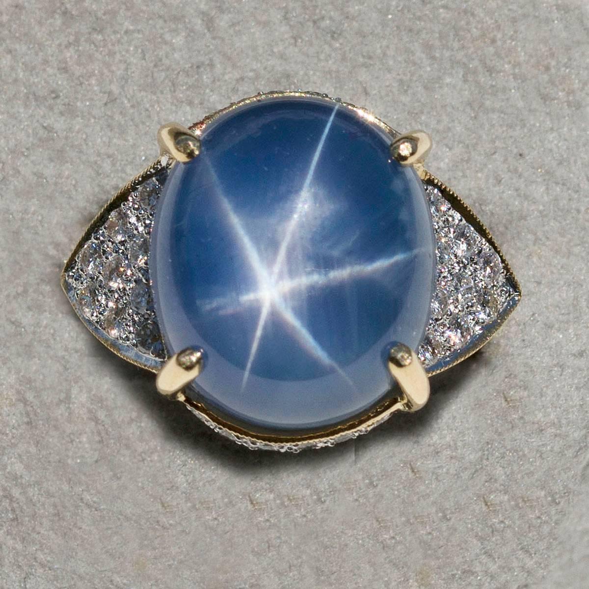 AGL certified 25.34 carat Burmese Star Sapphire set in 18k mounting with 52 round brilliant diamonds weighing 1.30 carats, 12.47g