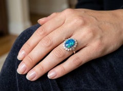 Anello in platino con opale blu e diamanti