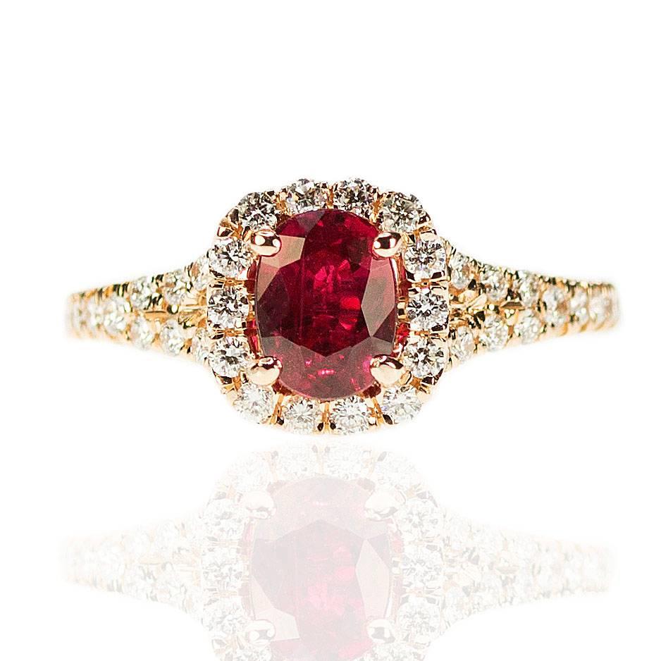 Beautiful AGL certified vivid red ruby weighing 1.12 carats set in 18k rose gold mountinf with 40 round brilliant weighing 0.38 carats. 3.76g