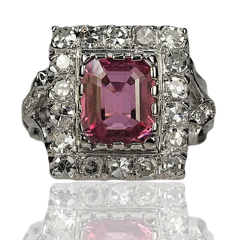14k White Gold Ring with one AGL certified 2.56 carat Pink Sapphire and twenty-four diamonds weighing approximately 0.90 carats. 6.17g