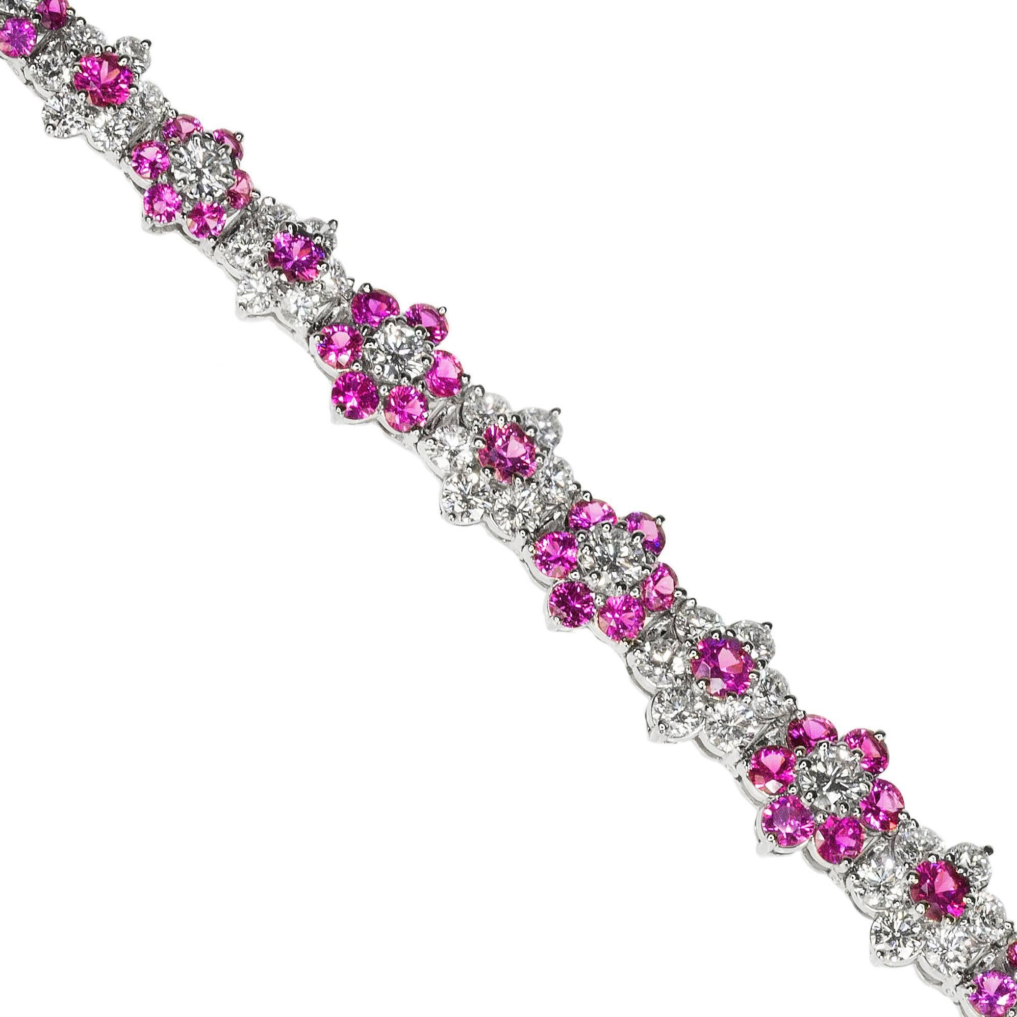 Platinum Oscar Heyman Bracelet containing 77 modern round brilliant diamonds weighing 12.10 carats and 77 hot pink sapphires weighing 18.15 carats. Bracelet is 8 3/4 inches long so could fit a large wrist or could make a pair of earrings out of the