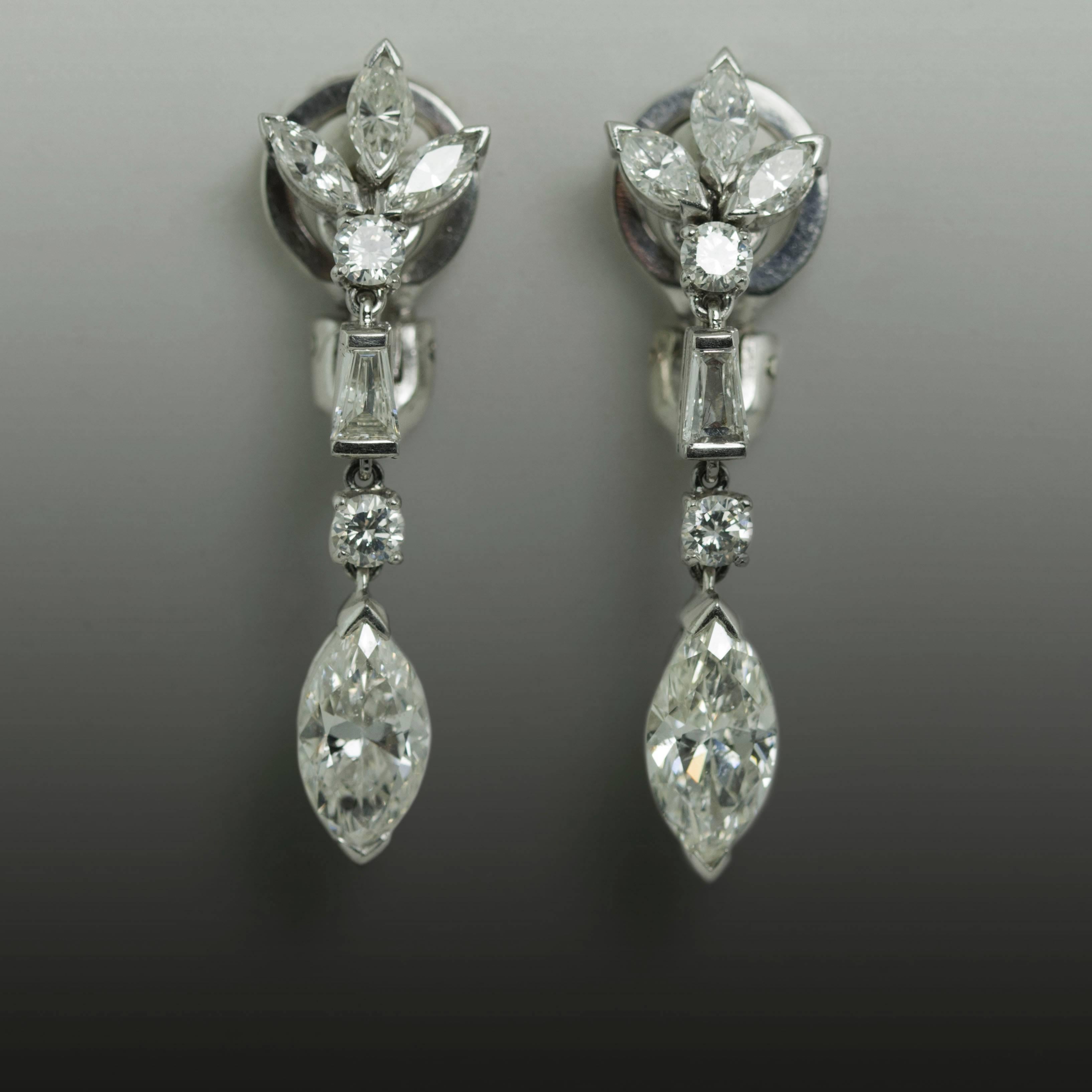 Platinum Earrings containing 2 Marquise cut diamonds weighing approximately 3.10 carats and 6 smaller Marquise cut diamonds, 2 round diamonds and 2 baguette cut diamonds weighing approximately 1.00 carats.