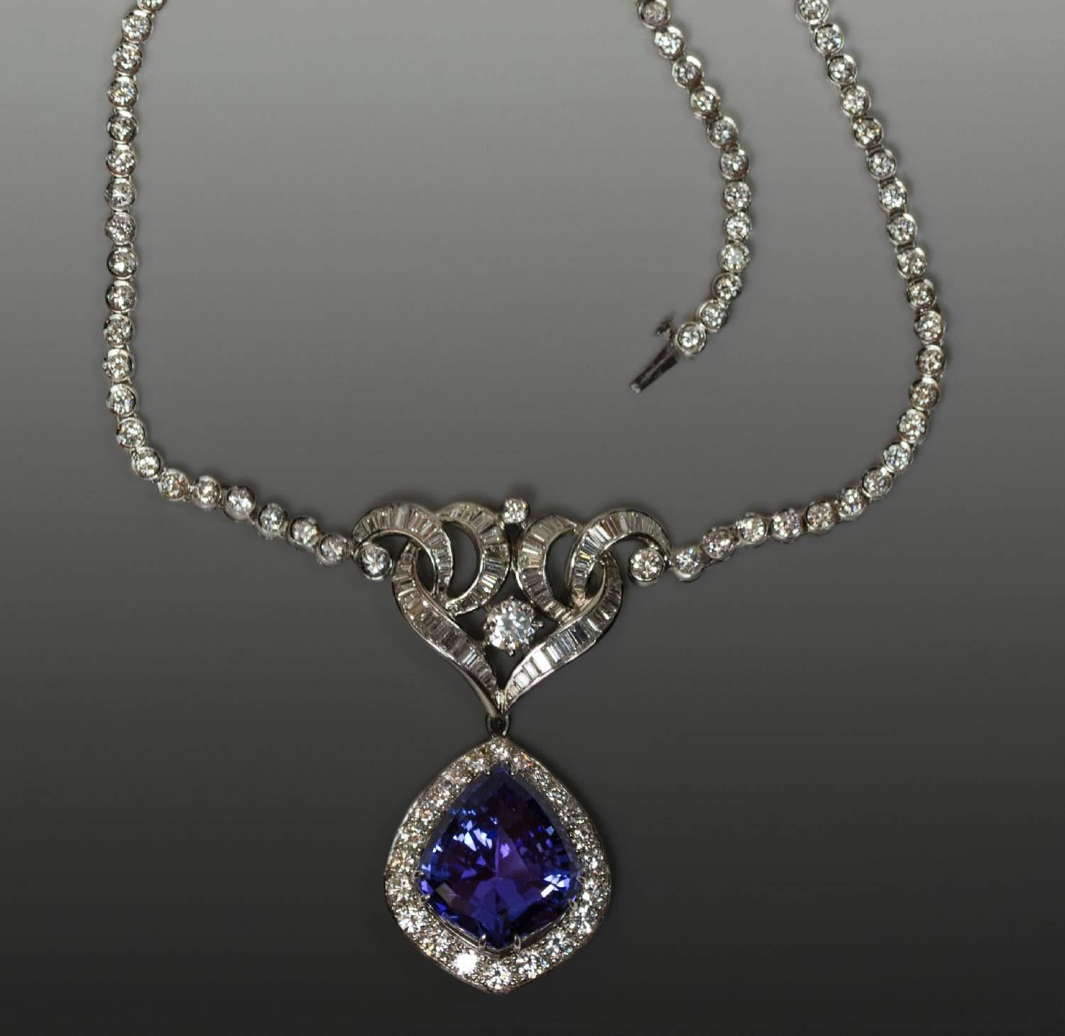 Platinum Necklace With 17.95 carat fancy shape Tanzanite and approximately 16.98 carats of round brilliant and baguette cut Diamonds,