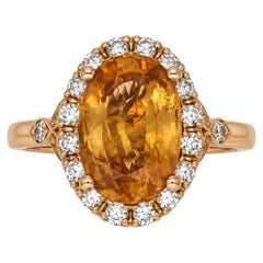 An 18k rose gold sapphire and diamond cluster ring