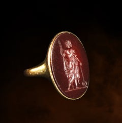 Un intaglio neoclassico in corniola incastonato in un anello d'oro a 18 carati. Zeus Labraundos