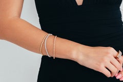 Elegantes Tennisarmband aus 14-karätigem Dreifarbgold mit funkelnden Brillanten
