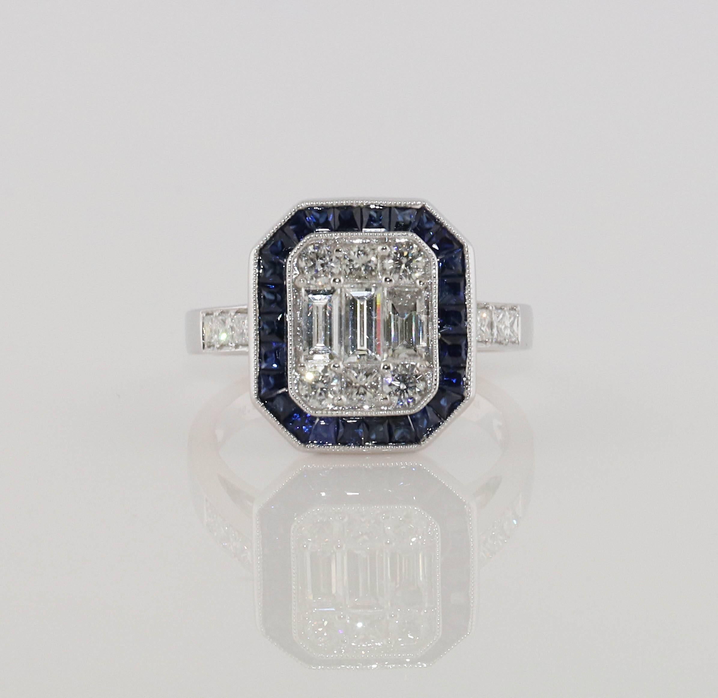 An Art Deco style engagement ring made in the modern day. Although the center looks like a 2ct emerald cut, it is actually a mosaic of smaller shaped diamonds, hand set, to look like a larger stone. This is a very labor intensive process and no