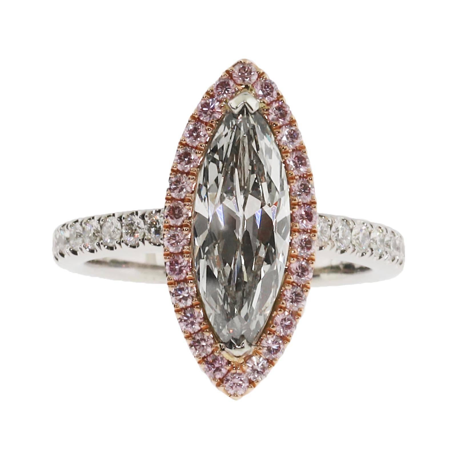 One of the rarest colored diamonds available on 1stDibs. This 2.05 Fancy Grey diamond ring is adorned with a natural pink diamond halo around the exterior of the marquise. The clarity grade of the 2.05 is a VS2 which means it is a very clean center