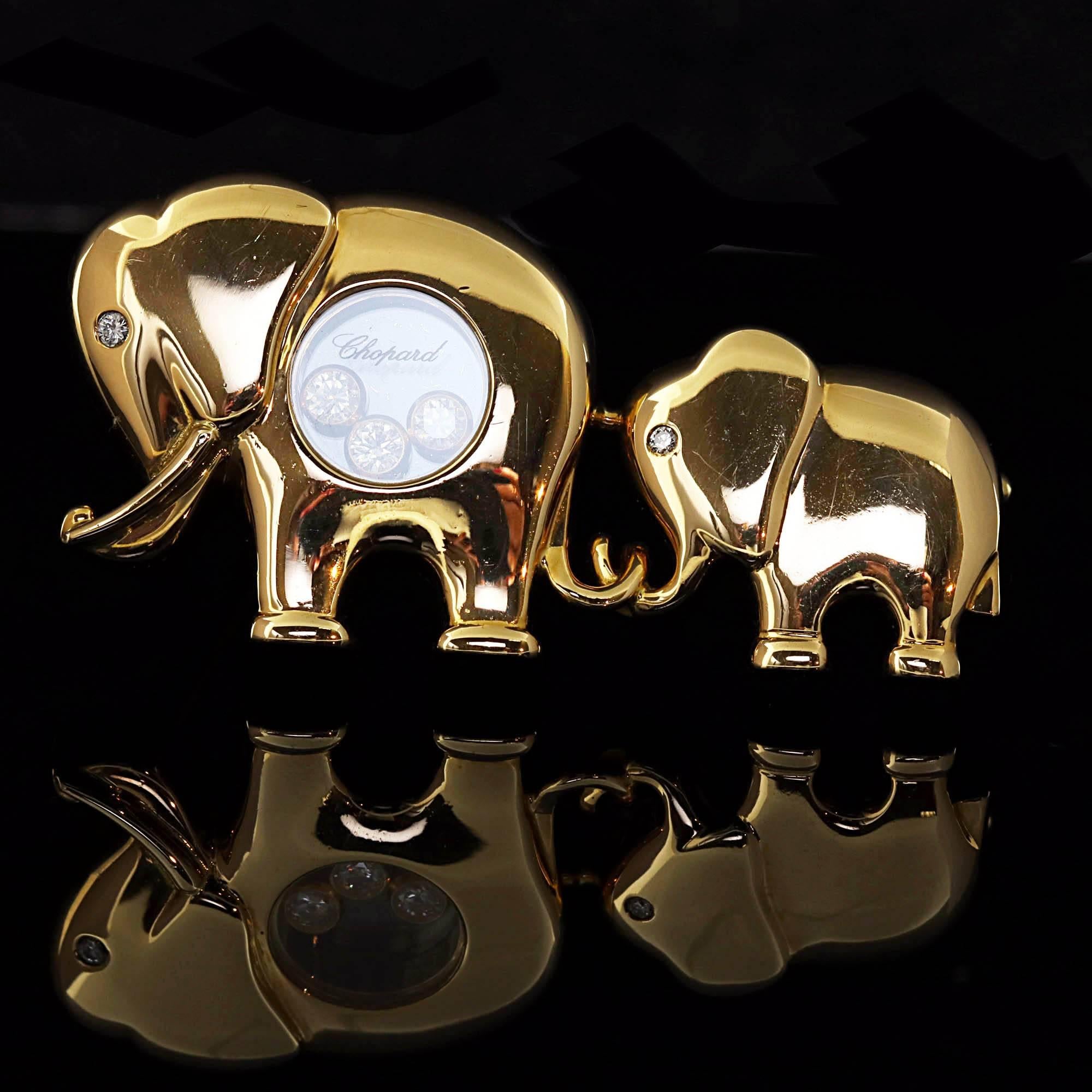This Chopard piece is finely crafted from solid 18k yellow gold. It features two adorable elephants designed with sparkling floating diamonds. Both the leading elephant and the baby elephant are adorned with a single diamond as an eye. 

Material: