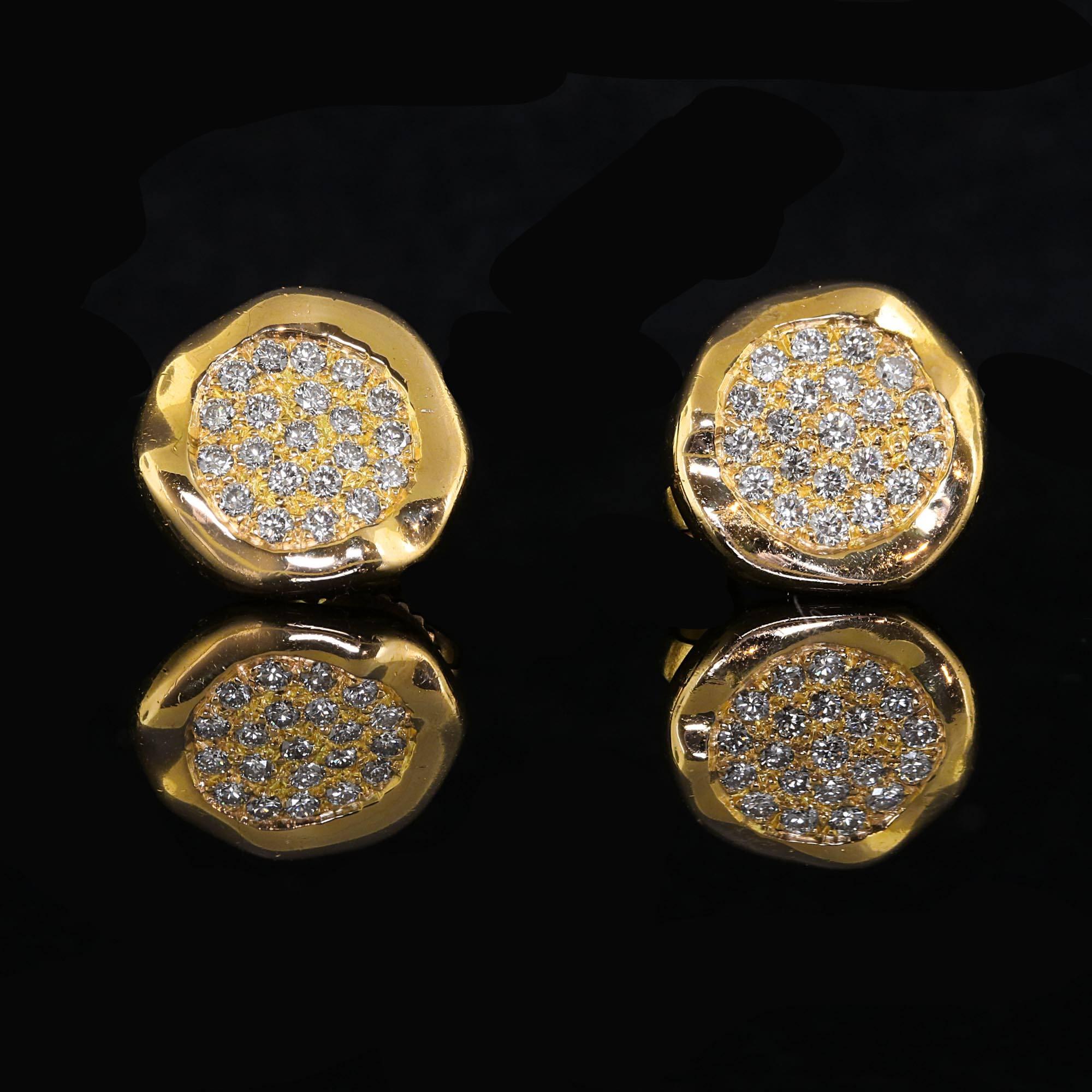 Perfect condition, beautiful pair of Tiffany and Company yellow gold earrings. The designer for these earrings is Angela Cummings. They are crafted in 18 kt yellow gold and adorned with approximately .50 carats of diamonds. All the diamonds are