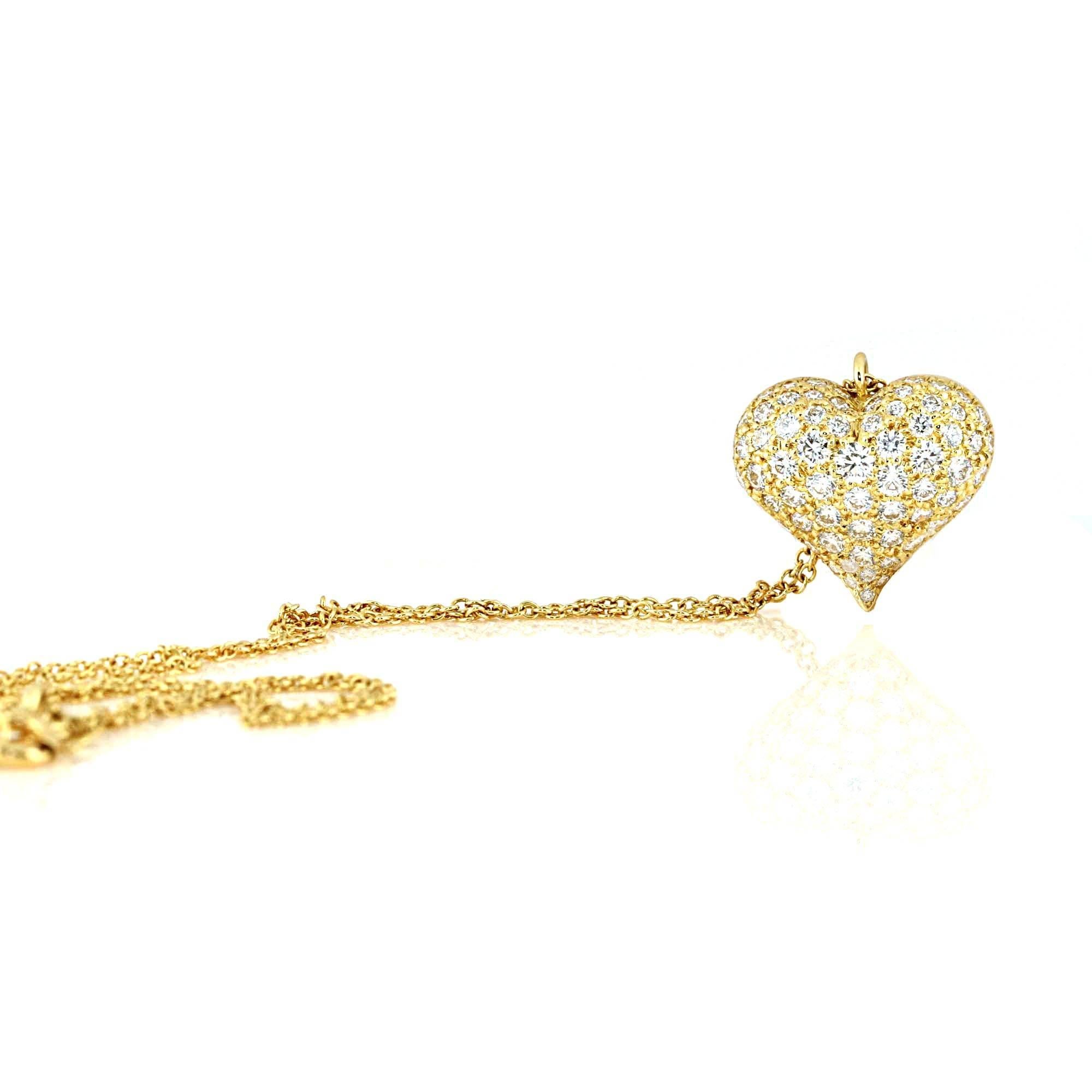 Gorgeous Tiffany & Co. yellow gold and diamond heart necklace. The diamonds in the heart weight approximately 1.80 carats. The color of the diamonds are F-G and are VS in clarity. One of the most timeless designs by Tiffany & Co. This can be dressed