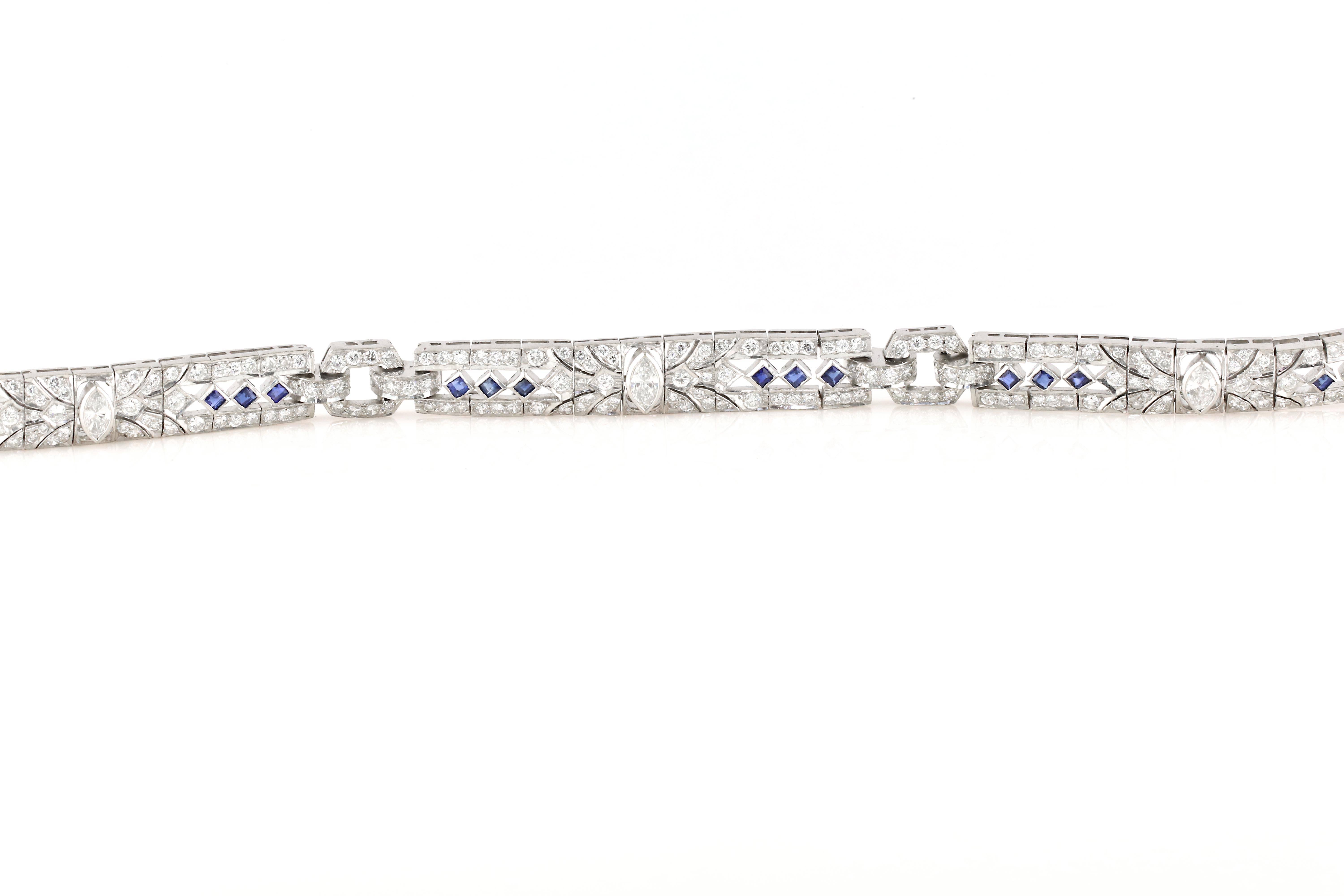 Get the look of art deco, without the premium price. This exquisite replica bracelet is set with diamonds and sapphires throughout. It is also set in 18kt white gold, not 14kt making it a much more premium piece. The sapphire are all Asscher/Square