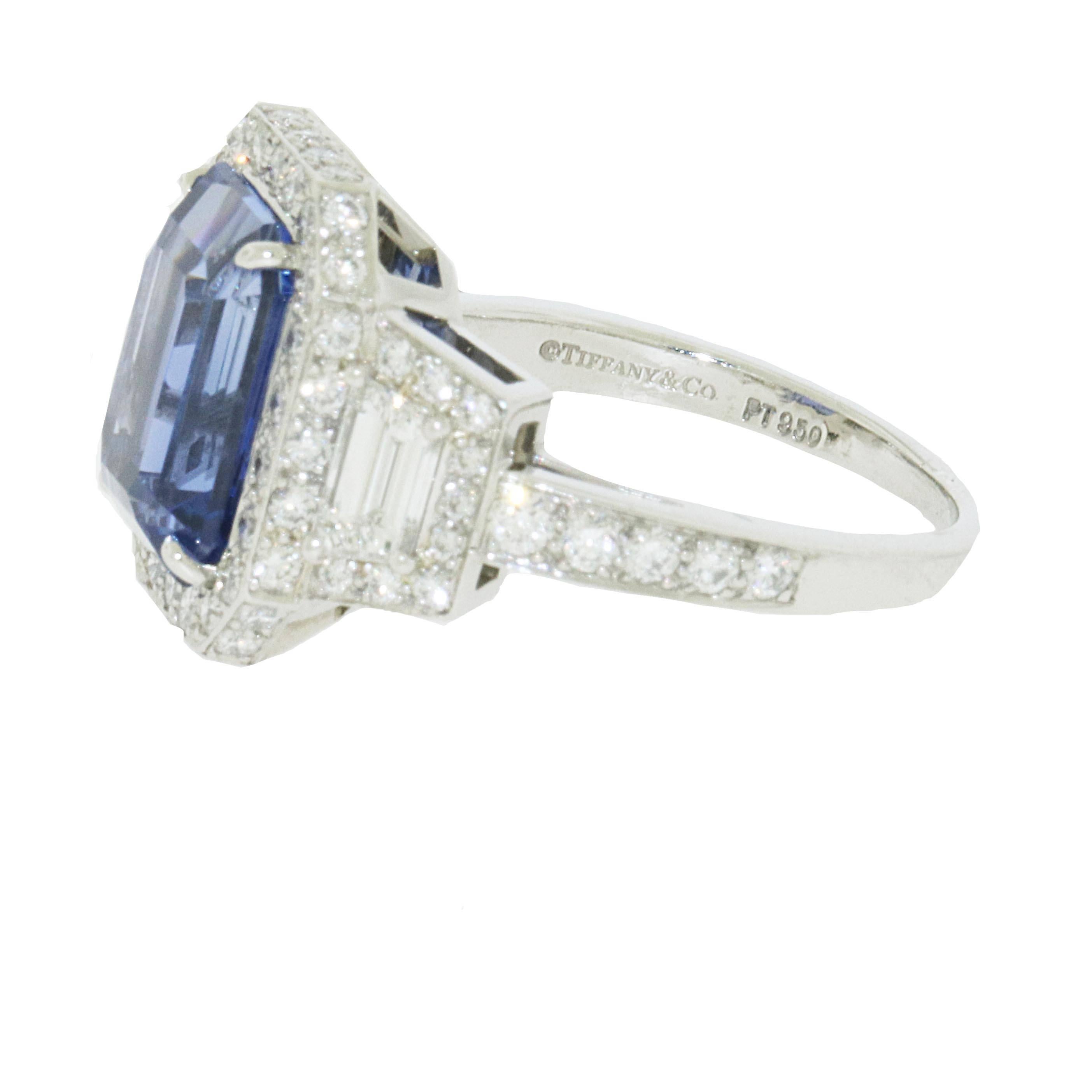 Most gorgeous Tiffany and Co. diamond and sapphire ring. The ring has a blue sapphire in the center with excellent color and clarity. The weight of the sapphire is 5.62 carats. It is surrounded by 2 trapezoid diamonds weighing 0.55 carats in total.