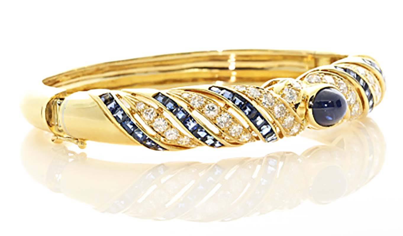 A truly gorgeous bangle bracelet that you can wear daily. Lilly is an amazing jewelry designer using only the finest of materials. The sapphire and diamond inlay is perfectly calibrated creating a gorgeous look. The center cabochon sapphire is a
