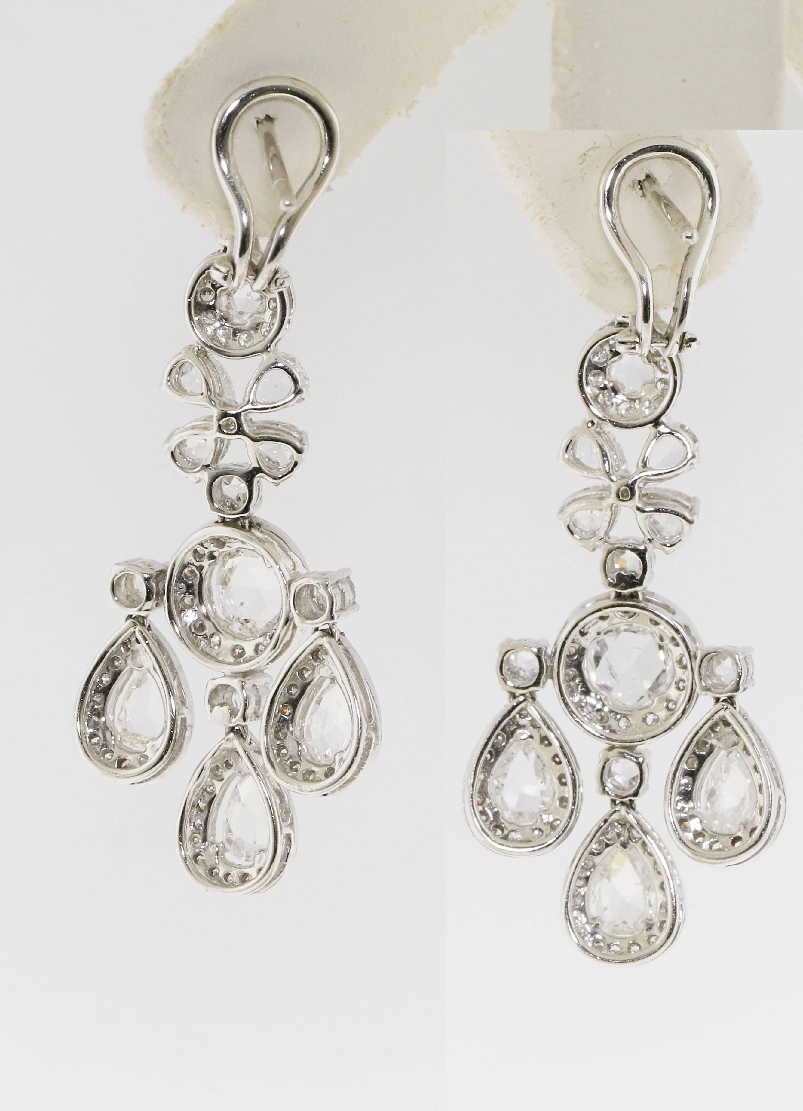 Gorgeous dangle chandelier diamond earrings. Known weight of 6.91 carats of white clean rose cut diamonds. These earrings are beautiful. They are long enough to be worn for a fancy black tie event, but fun enough to wear everyday. The perfect pair