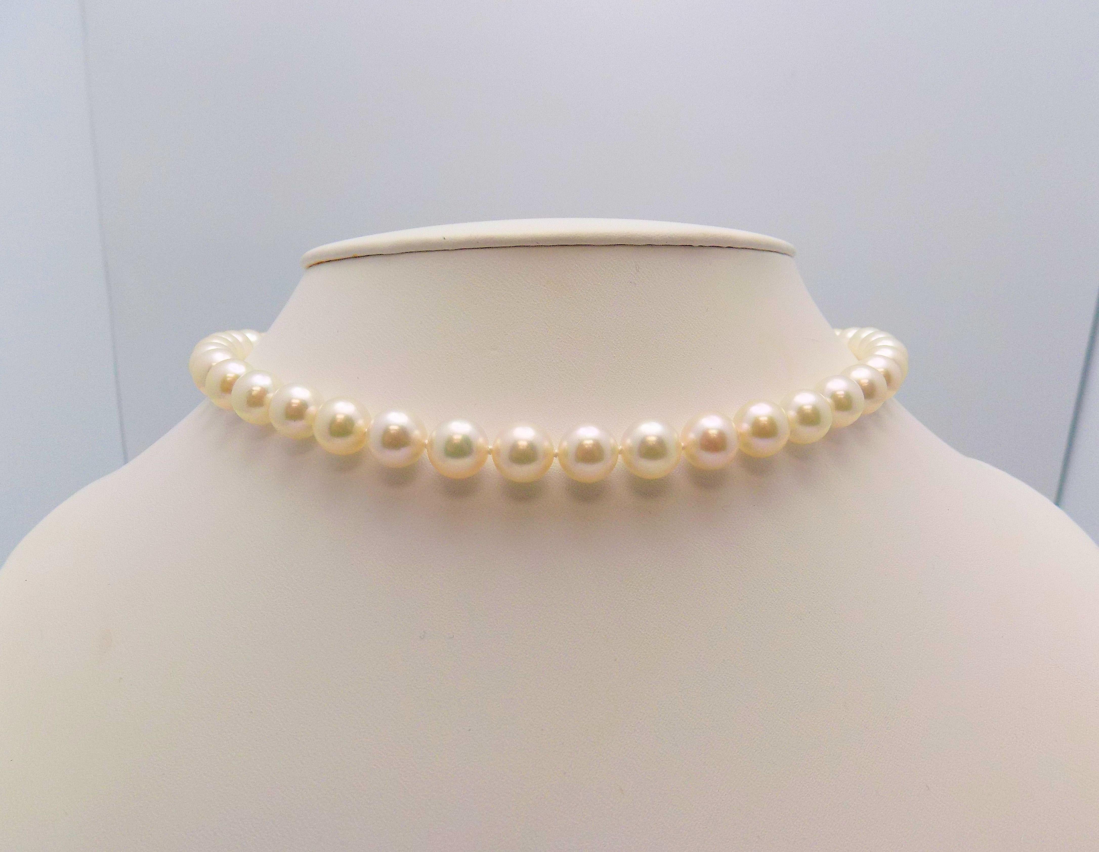 Dreamy Strand of 45 Cultured Pearls Measuring 9 X 9.5 MM. Extremely Well-Matched Cream Rose, Excellent Luster.  18 Karat White Gold Push/Turn Ball Clasp has 20 Round Brilliant Diamonds 0.27 Carat Total Weight, VS, G . 17.5” Long.  

The Jewelry