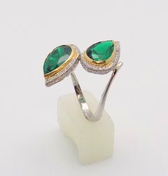 Pear Shaped Emeralds and Diamond Bypass Ring in Platinum and 18 Karat Gold