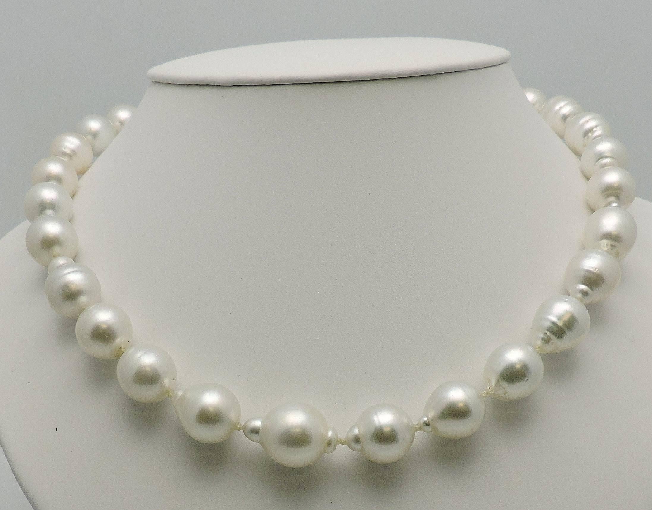 Brilliant silvery white luster, very bright. That color everyone wants.    Measure 12.6 x 16 mm. 
27 Pearls.
18K wg clasp set with 0.35 ct. tw in round diamonds SI, H.
Measurement with clasp 20 inches. 
Clasp measures 2 inches.  Simple foldover