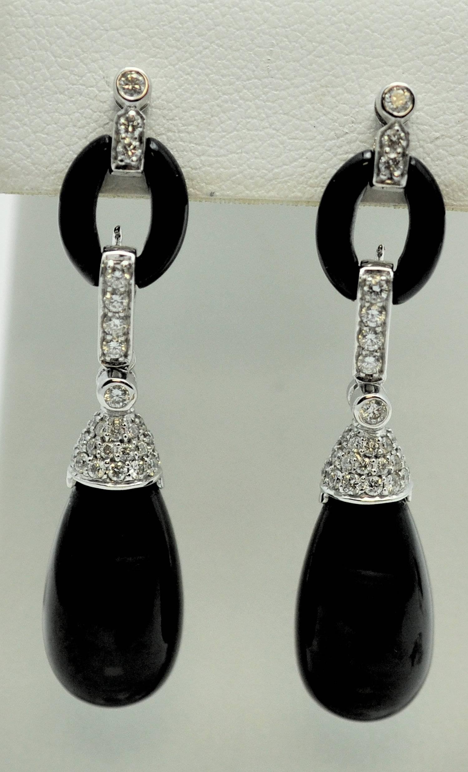 Modern day interpretation of the class Art Deco style that everyone loves. Each section moves with the wearer.  The bottom pendant drop is removable to add other stones if you wish; perhaps a lovely pear shape diamond.  Black onyx teardrop measuring