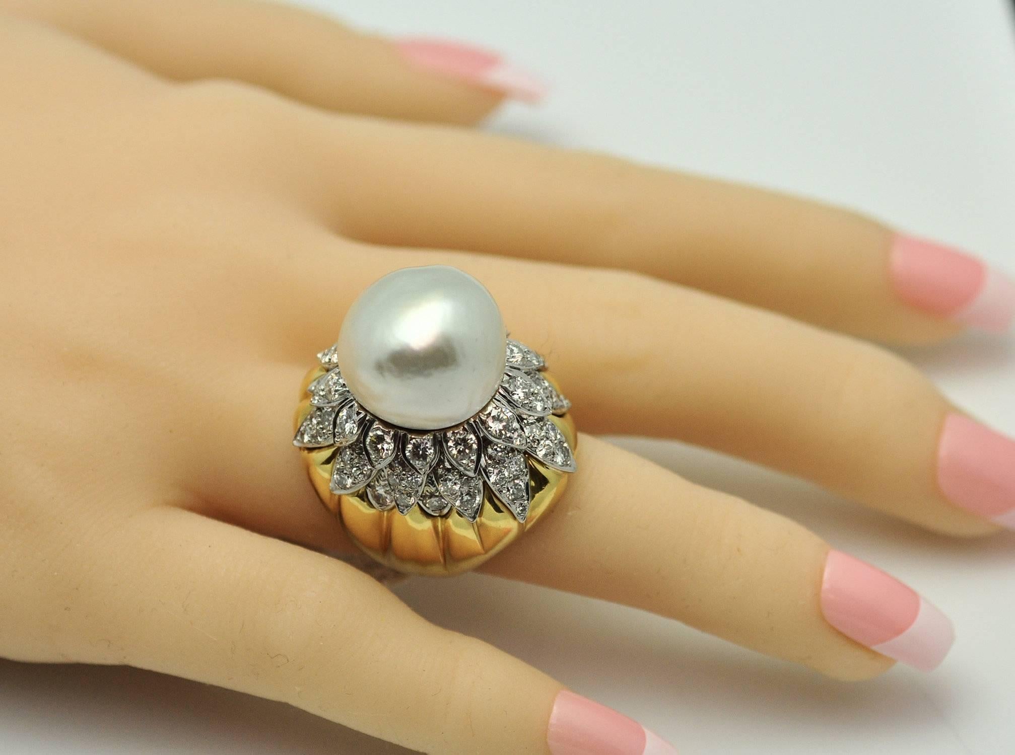 A spectacular statement ring with large baroque South Sea cultured pearl measuring 17.8 mm. with overlapping petals of diamond set on a bed of gold. There are 82 round diamonds with a total weight of approx. 5.00 ct. VS-2, G.  Beautifully made in