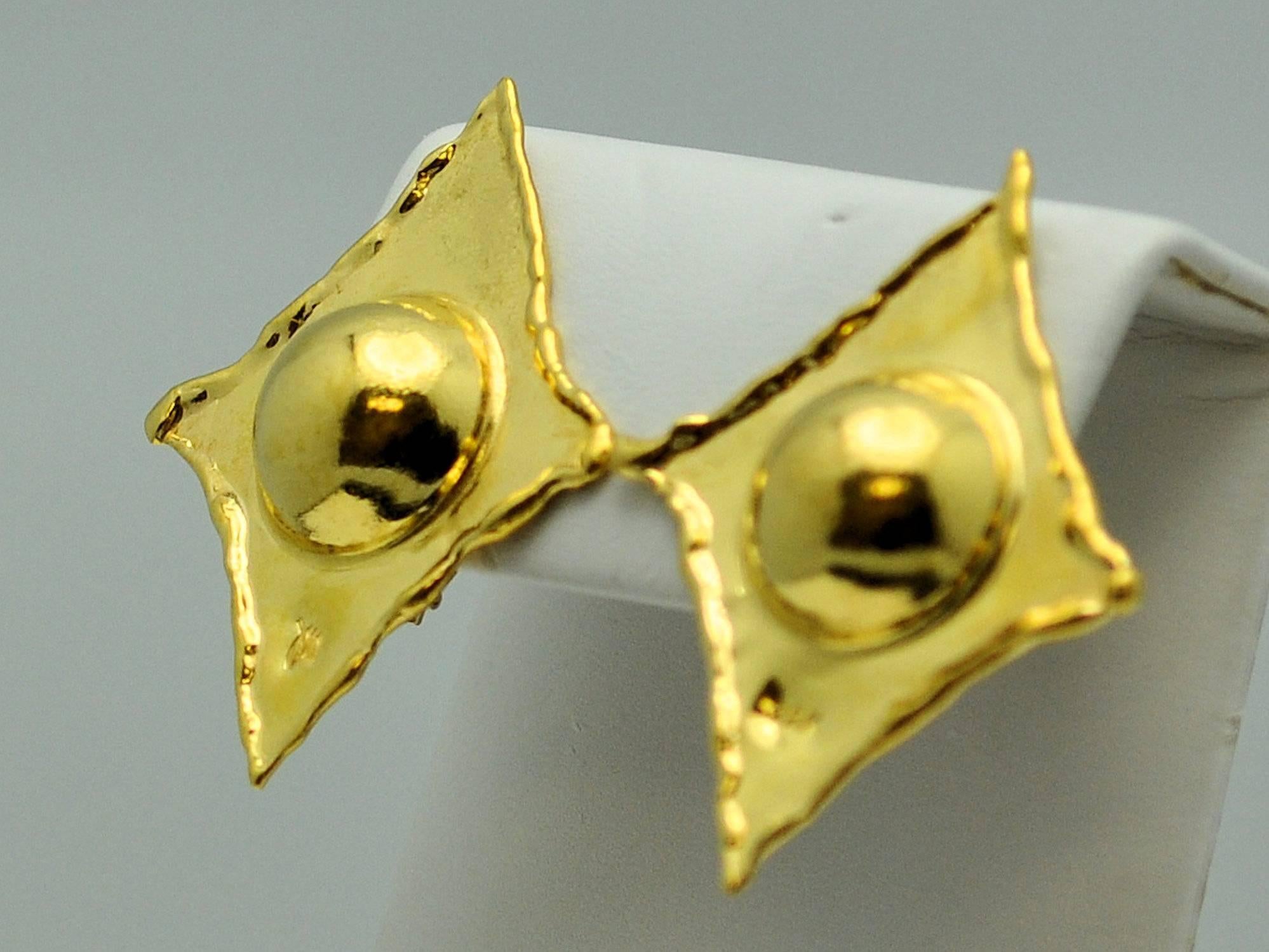 Diamond shape earrings with deep center dome, and detailed border in the trademark style of Jean Mahie.  Hand-wrought so that no two pieces are alike.  Clip back. Signed and gold mark on front of earrings. 