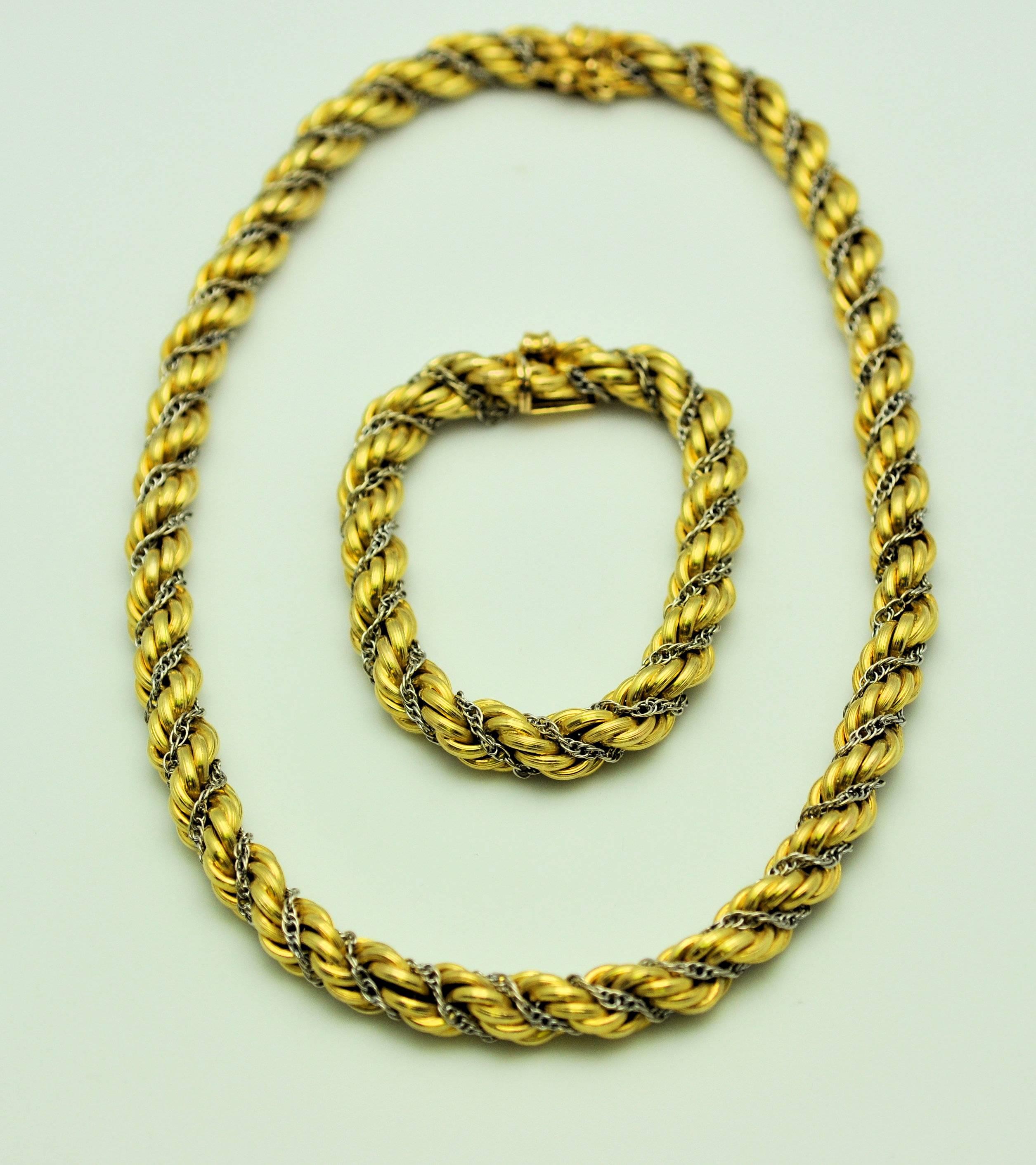 14K yellow textured yellow gold with white gold chain detail.  The white gold chain rests inside groove of the rope chain.  The two combine to create another necklace measuring 24 inches.  This piece was a wardrobe staple in the 1950's.  The