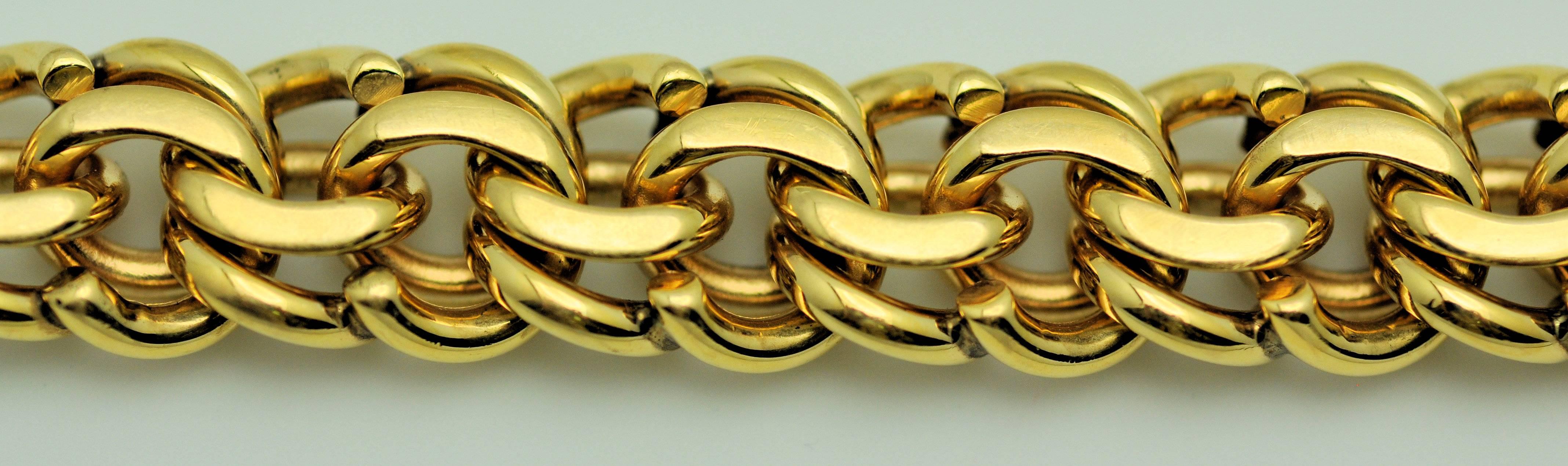 This is the kind of bracelet ladies wore in the 50s with their large, heavy charms.  This is solid 14K yellow gold and signed from Neiman Marcus.  It measures 8.5 inches, approximately .5 inches wide. Wear on its own or with heavy gold charms. Can