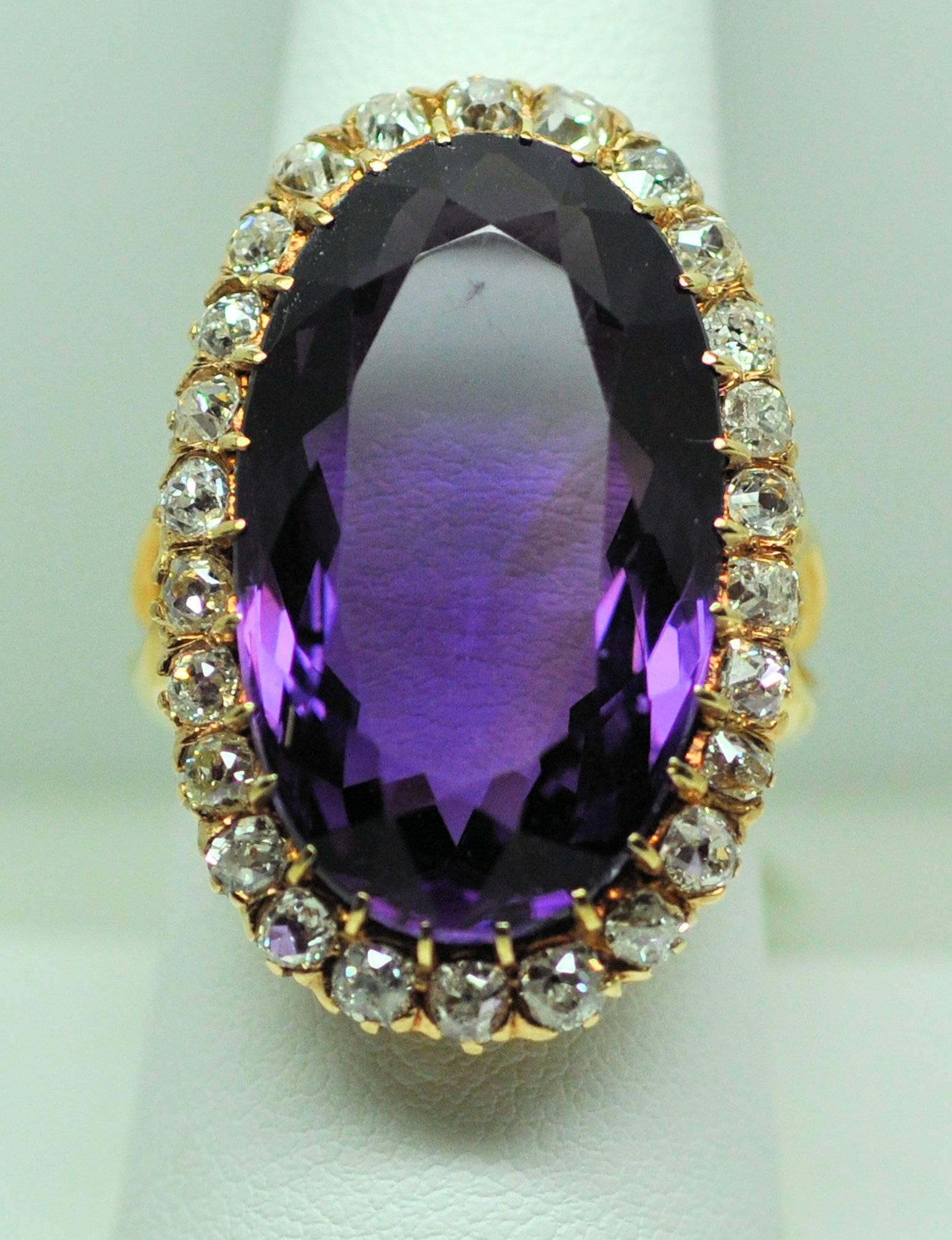 14K rose gold antique ring set with large oval amethyst 22.50 ct. surrounded by Old Mine cut diamonds 2.60 ct. total weight of grade SI, I-J. 12.8dwt. Beautifully engraved under bezel. 