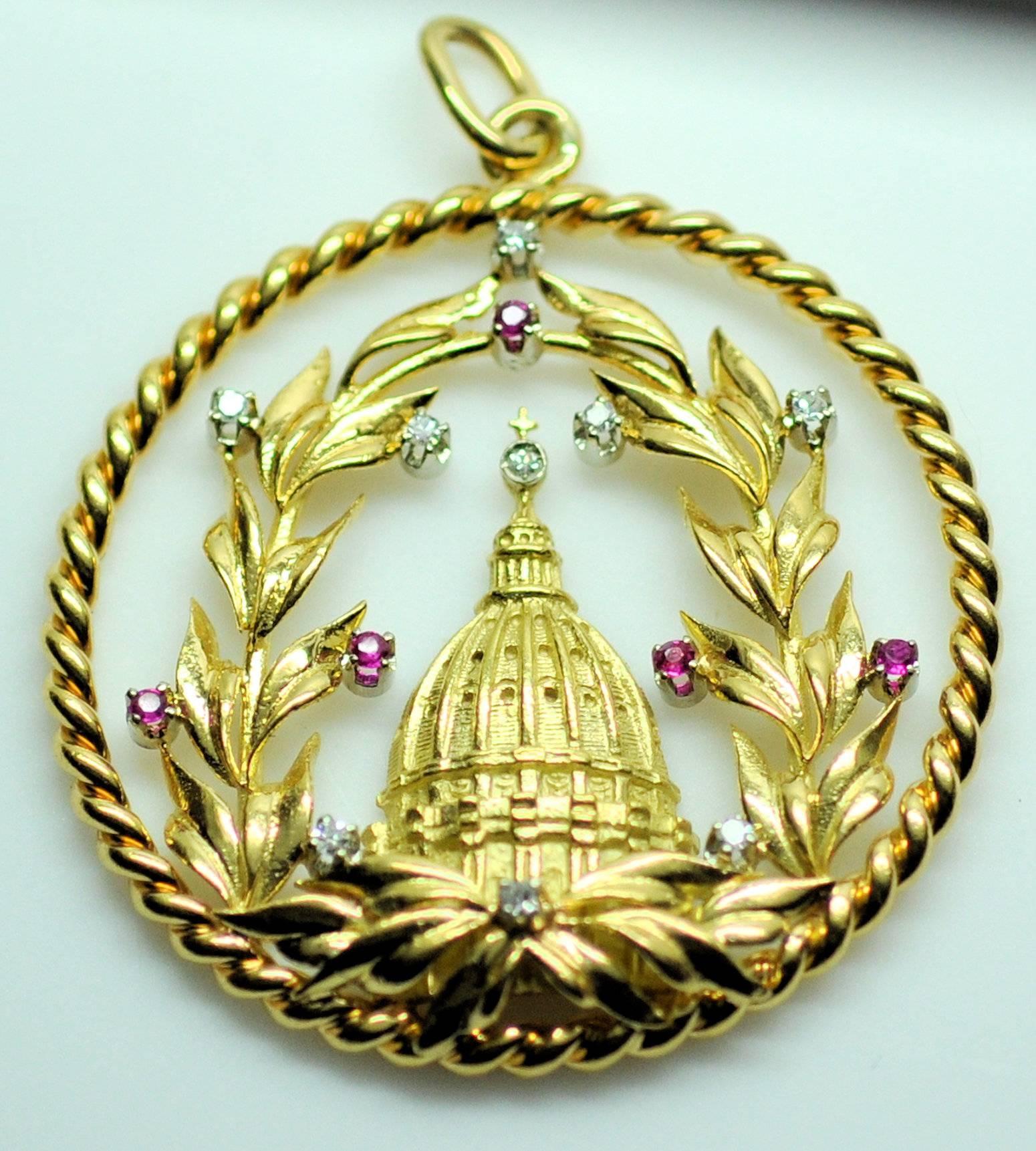 Vatican with laurel wreath. Fine workmanship and 18K yellow gold with white gold stone settings. Set with 9 round diamonds 0.09 ct. total weight and 5 round cut rubies 0.05 ct. total weight. Signed:  750