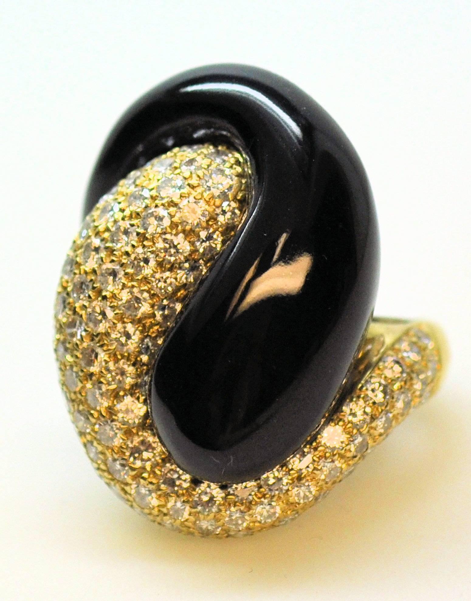 18 Karat yellow gold yin-yang style ring with diamond pave' set and custom cut black jade.  Set with 93 round brilliant cut diamonds 3.00 carats total weight of grade VVS-2, G. 11.9 dwt. gross wt.  This ring has attached horseshoe guard, so the ring