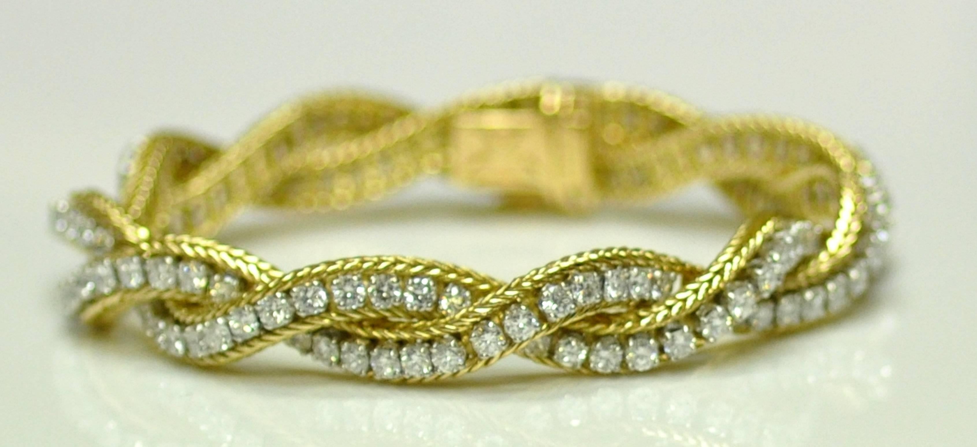 French-made Neiman Marcus bracelet is 18 karat and platinum.  Hallmarked and numbered.  Twist foxtail with prong set diamonds.  Contains 161 round diamonds 6.50 carats VS, G.  26.0 dwt. 