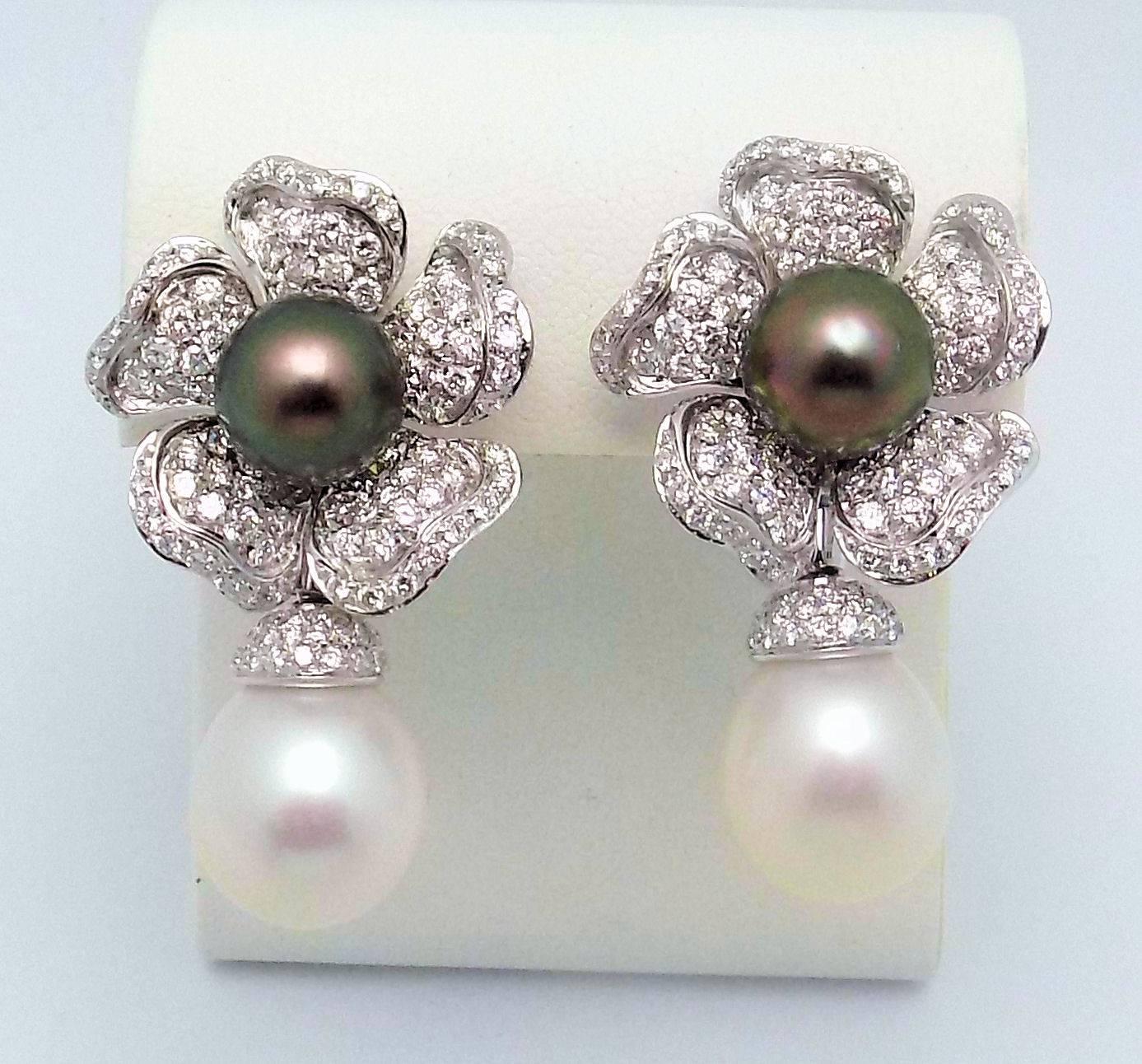Especially beautiful and versatile earrings, created in floral motif with Tahitian South Sea cultured pearl centers and pave' diamond petals, removable South Sea cultured pearl drop.  The black pearls measure 10 mm. and the white pearls measure 12 x