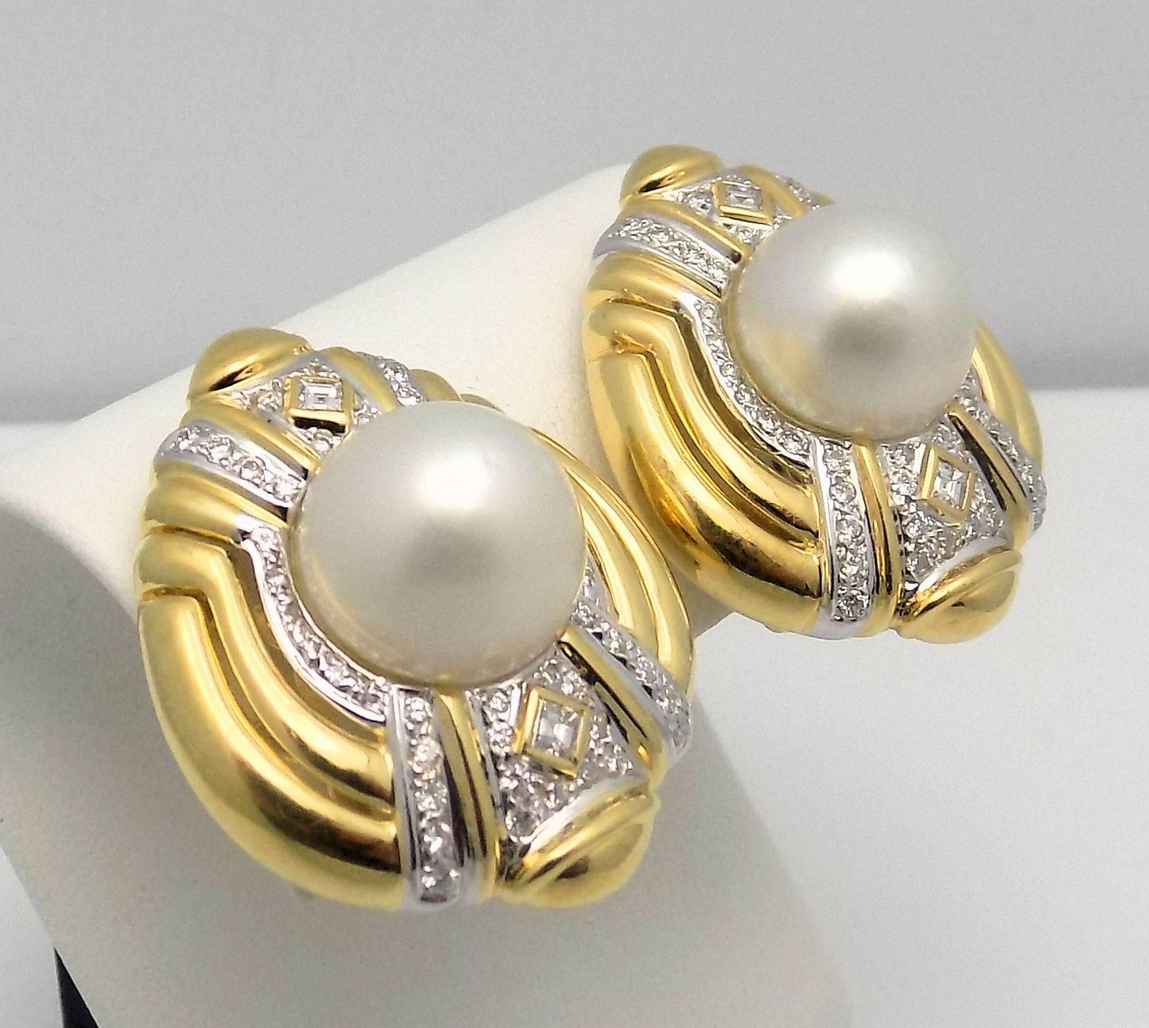 These statement earrings are set in 18 Karat yellow gold with center of round, high dome mobe' cultured pearls.  The pearls measure 13 x 13.5 mm. with bright luster.  There are four square and 88 round brilliant cut diamonds with a combined weight