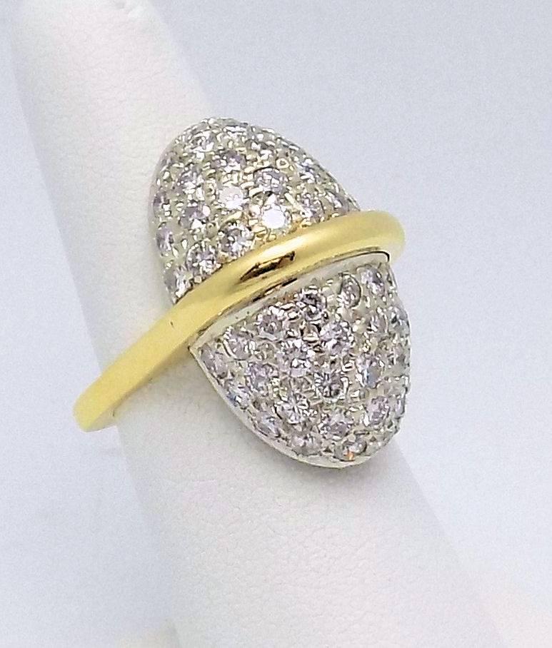 With squared shank and oval pave' top, this designer ring contains 62 round diamonds 3.00 carats VS-SI, H-I. 10.1 DWT. Finger size 6.5.  Can be sized. 