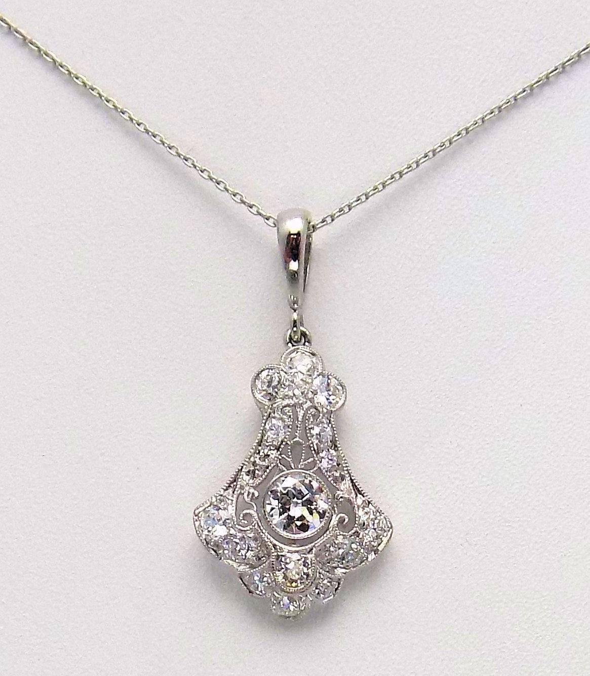 Antique platinum filigree pendant of exceptional workmanship, set with European cut diamonds. There are 17 European cut diamonds .66 carat, VVS/VS, F-G.   The last photo shows the workmanship of Oscar Heyman, an old New York company, known for high