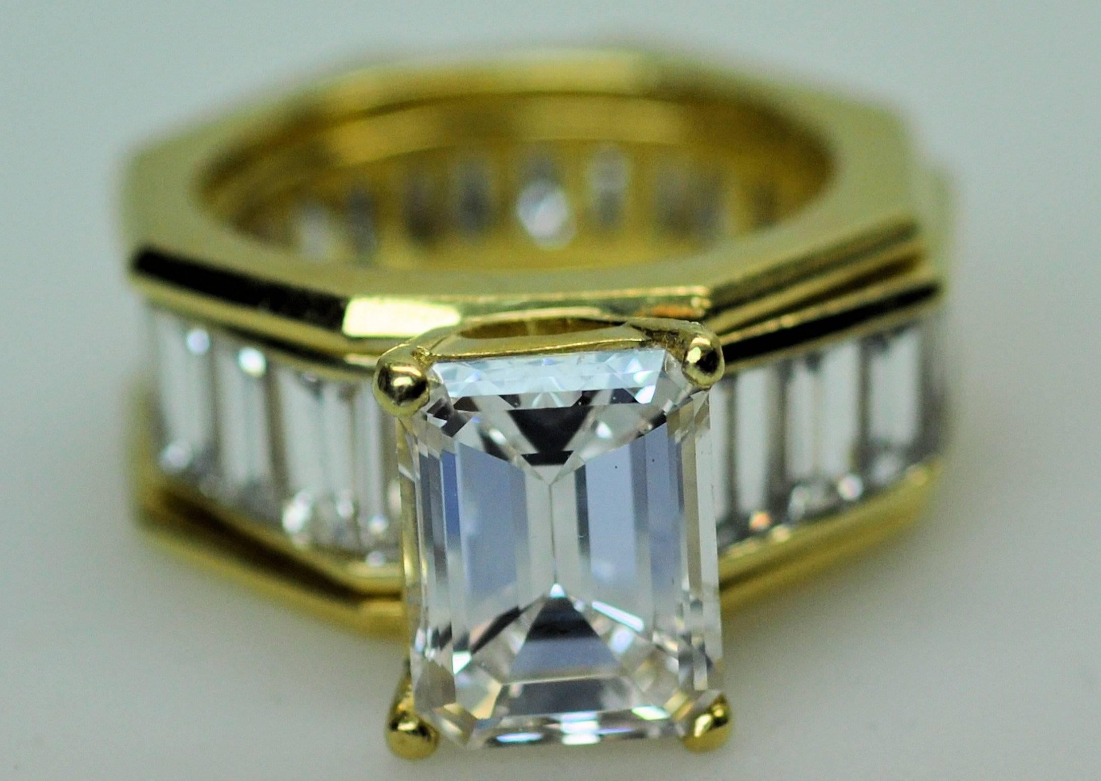 18 Karat custom made engagement semi- mount ring and baguette diamond hexagonal wedding ring. The emerald cut weighs 4.09 carat GIA report SI-1, H, 2185389683.  The wedding ring contains 22 baguette cut diamonds approximately 7.00 carats total