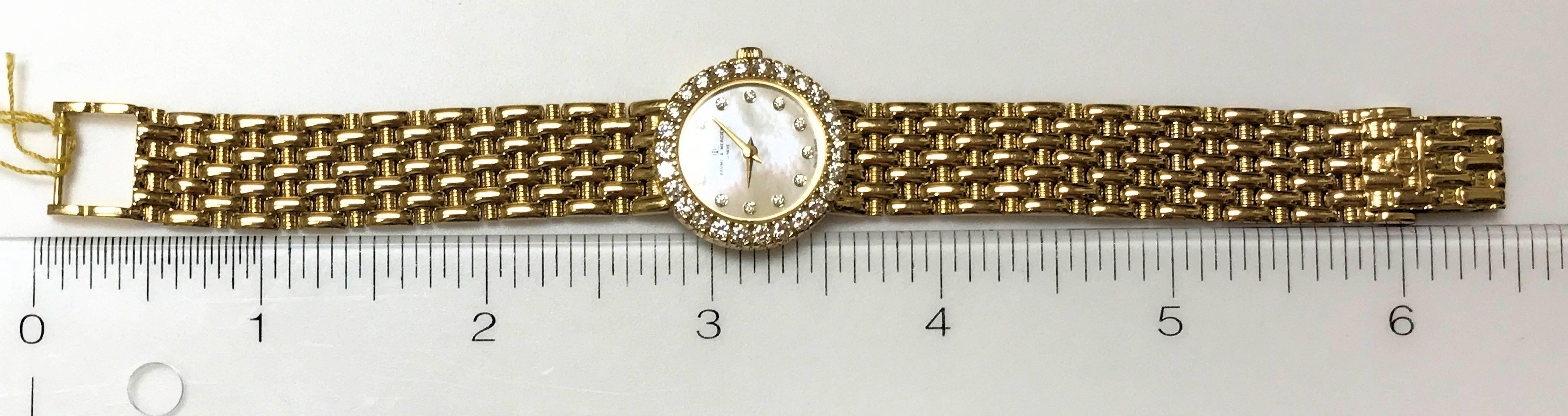 Women's Baume Mercier Yellow Gold Mother-of-Pearl Diamond Dial and Bezel Wristwatch For Sale
