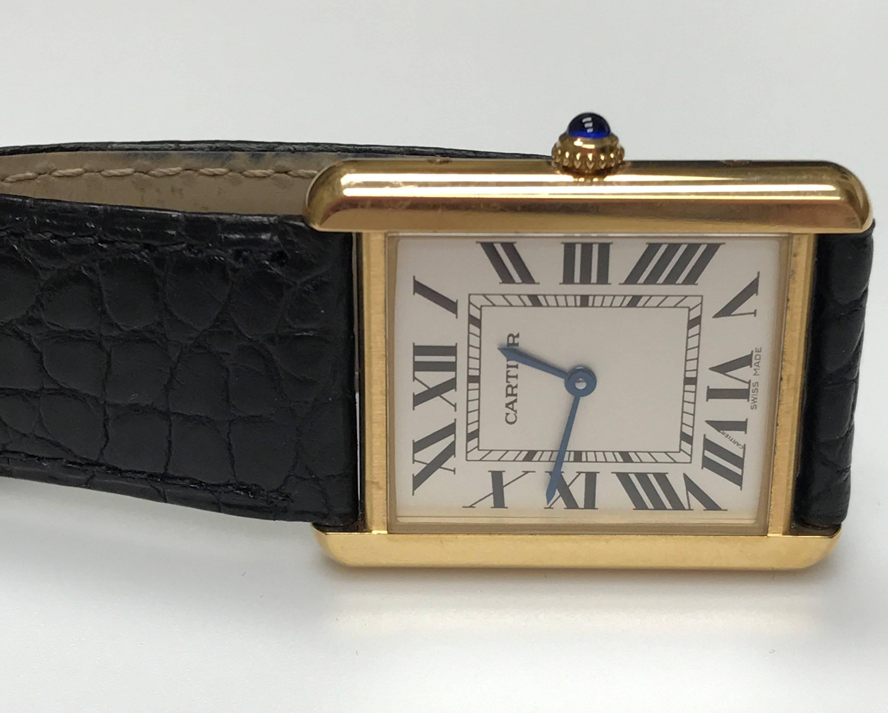 The Tank Solo 2742 is just the perfect size for a  lady's large watch or a medium gentleman's watch.  Alligator Cartier strap with 18 Karat yellow gold Cartier buckle. 9 inches long. easily fits a 7-7.5 inch wrist. Sapphire bead border crown